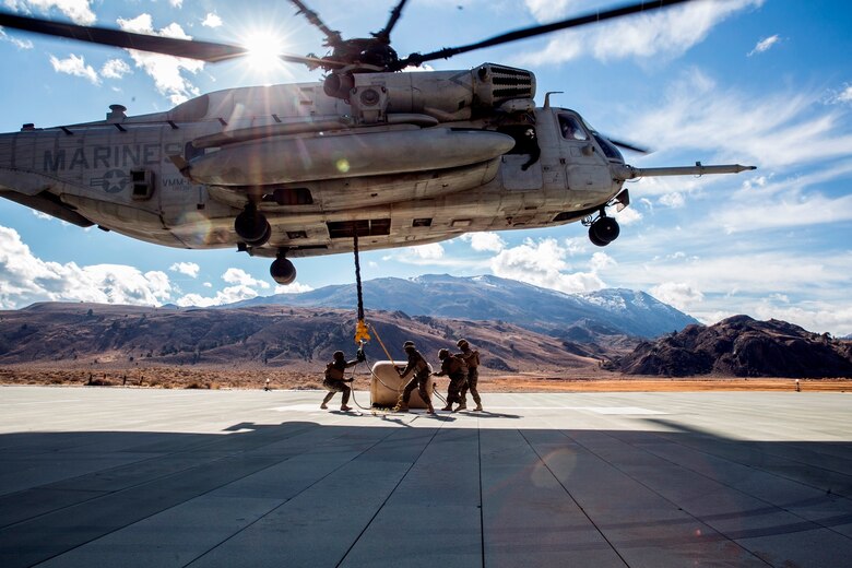 U.S. Marines with Combat Logistics Battalion 15, 1st Marine Logistics Group, and 3rd Battalion, 4th Marine Regiment, 1st Marine Division, strap a 500-gallon drum of water to a CH-53E Super Stallion, with Marine Heavy Helicopter Squadron 466, during a Helicopter Support Team drill at Mountain Warfare Training Center, Bridgeport, Calif., Oct. 25, 2016. The drum was taken into the Sierra Mesa Mountains to support Marines who are conducting field operations during Mountain Exercise 6-16. (U.S. Marine Corps photo by Lance Cpl. Adam Dublinske)
