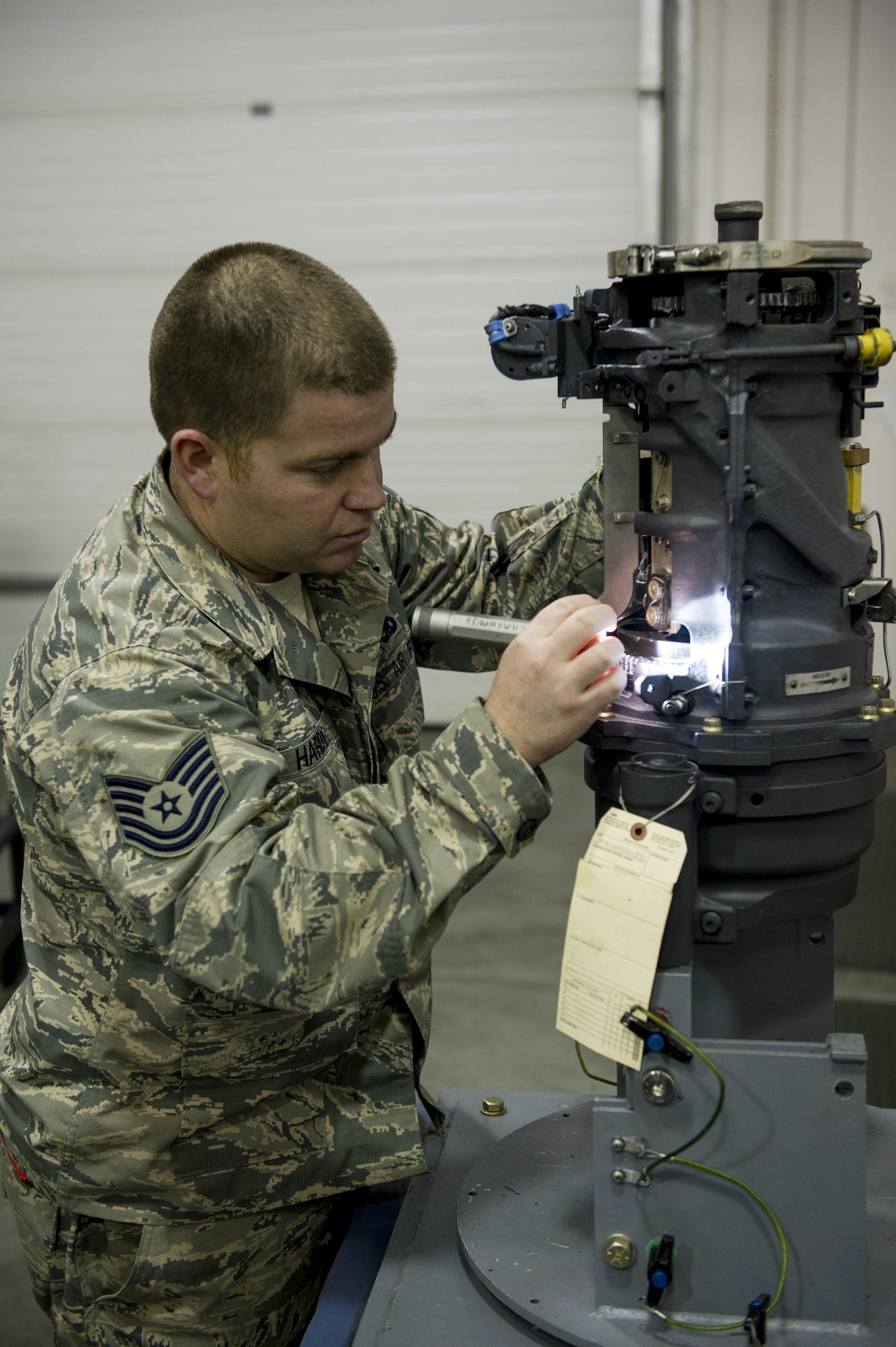 U.S. Air Force Tech. Sgt. Ben Hardy, the 354th Maintenance Squadron armament maintenance noncommissioned officer in charge, performs a final inspection on an aircraft gun Nov. 3, 2016, at Eielson Air Force Base, Alaska. After the weapon has been taken apart, repaired and reassembled Hardy ensures that it is ready to go back on the aircraft. (U.S. Air Force photo by Airman Isaac Johnson)