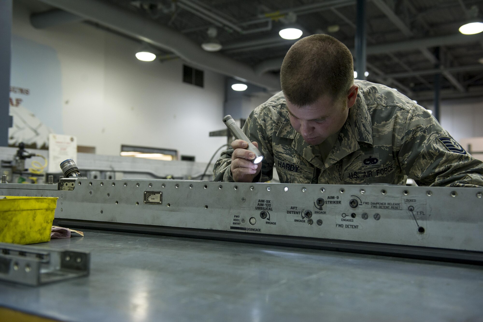 U.S. Air Force Tech Sgt. Ben Hardy a 354th Maintenance Squadron armament maintenance noncommissioned officer in charge, examines an LAU-129 missile rail launcher Nov. 3, 2016, at Eielson Air Force Base, Alaska. The LAU-129 is a missile rail launcher compatible with Advanced Medium-Range Air-to-Air Missiles, sidewinder missiles and similar weapons. (U.S. Air Force photo by Airman Isaac Johnson)