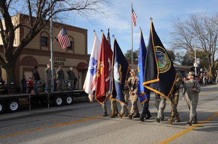 Members of U.S. Strategic Command’s (USSTRATCOM) Joint Color Guard march in the 2016 Veteran’s Day Parade in Bellevue, Neb., Nov. 5, 2016. Senior leaders from USSTRATCOM and the 55th Wing also attended the seventeenth annual parade to support the service members from their respective commands who volunteered to participate and honor U.S. veterans, both past and present.