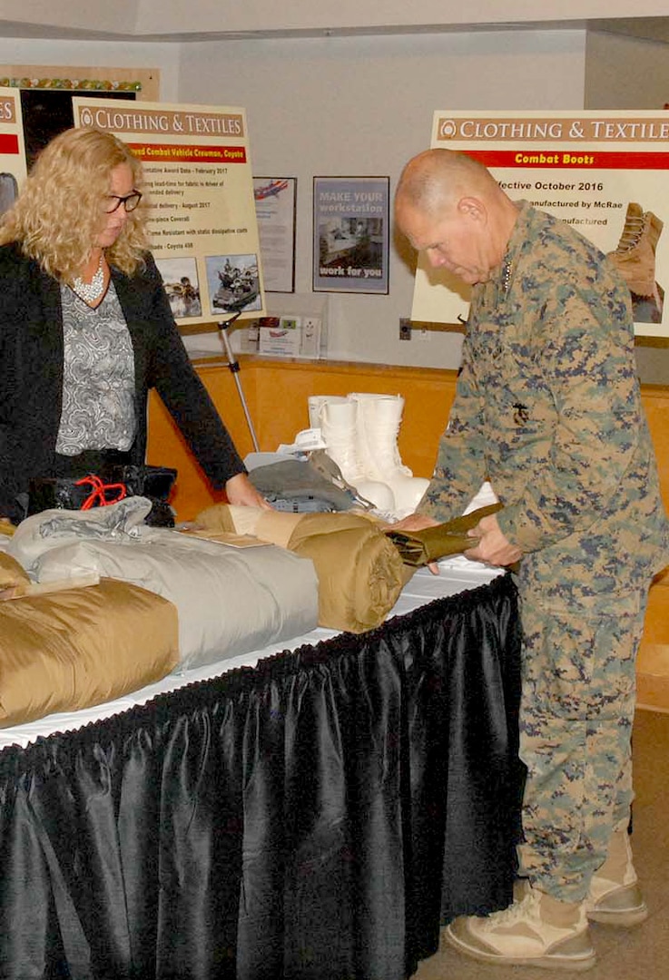 Gen. Robert B Neller, commandant of the Marine Corps, sees the extreme cold weather gear that the Clothing and Textiles supply chain procures for Marines during a visit to DLA Troop Support Nov. 2 in Philadelphia.