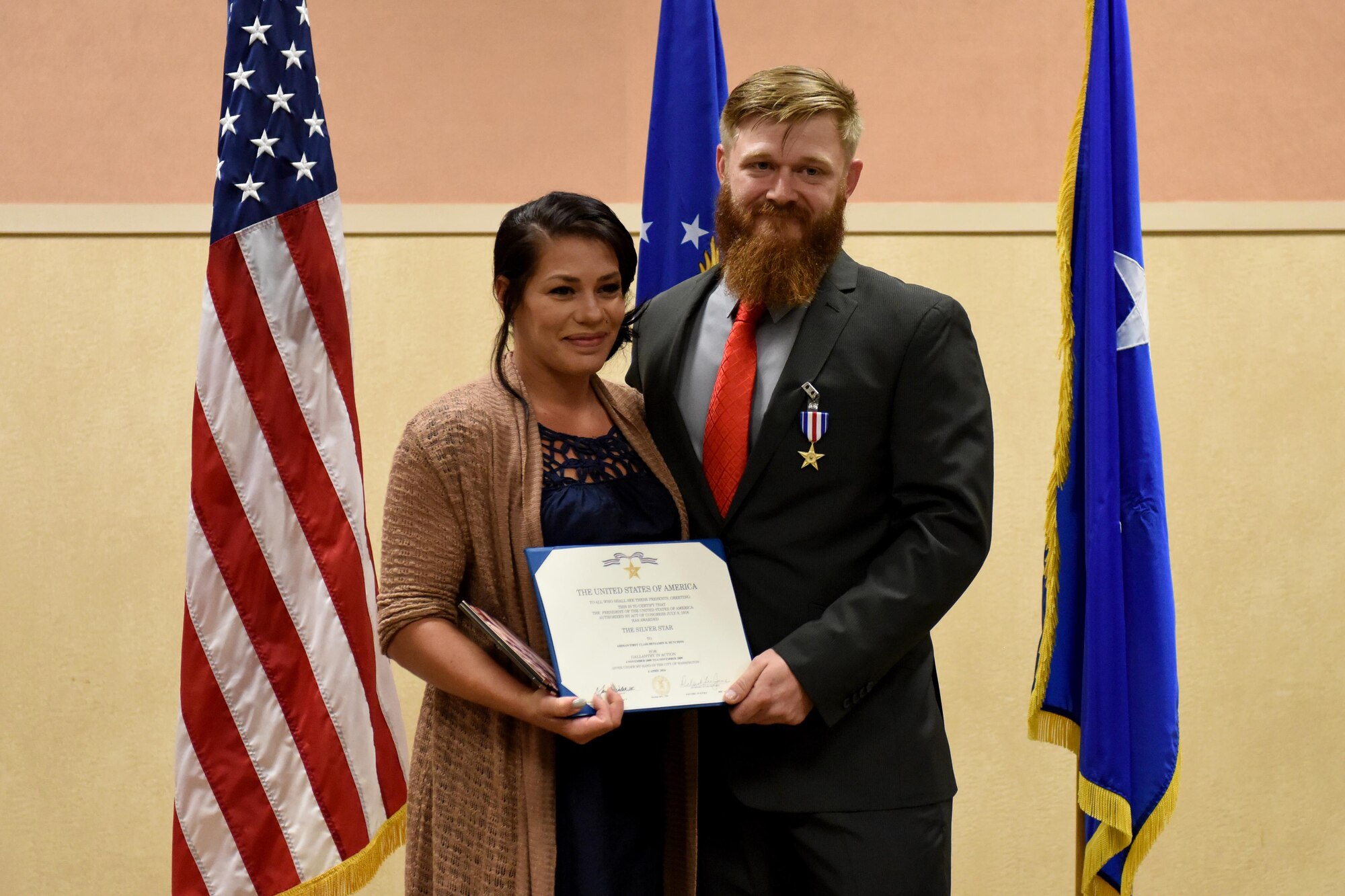 Retired Staff Sgt. Benjamin Hutchins, 18th Air Support Operations Group joint terminal attack controller, and his wife, Heather Hutchins, pose for a photo after a ceremony, Nov. 4, 2016, at Pope Army Airfield, North Carolina. Hutchins received the Silver Star Medal for his actions in spite of imminent danger while facing hostile forces during OPERATION ENDURING FREEDOM in 2009. (U.S. Air Force photo by Airman Miranda A. Loera)