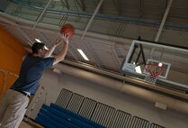 Airman 1st Class Cody Sluder, 791st Missile Security Forces Squadron member, shoots a basketball at Minot Air Force Base, N.D., Oct. 15, 2016. Sluder was the only Airman chosen from Minot AFB to attend the 2016 All-Air Force men's basketball team trial camp at Joint Base San Antonio-Lackland, Texas. (U.S. Air Force photo/Airman 1st Class Jonathan McElderry)