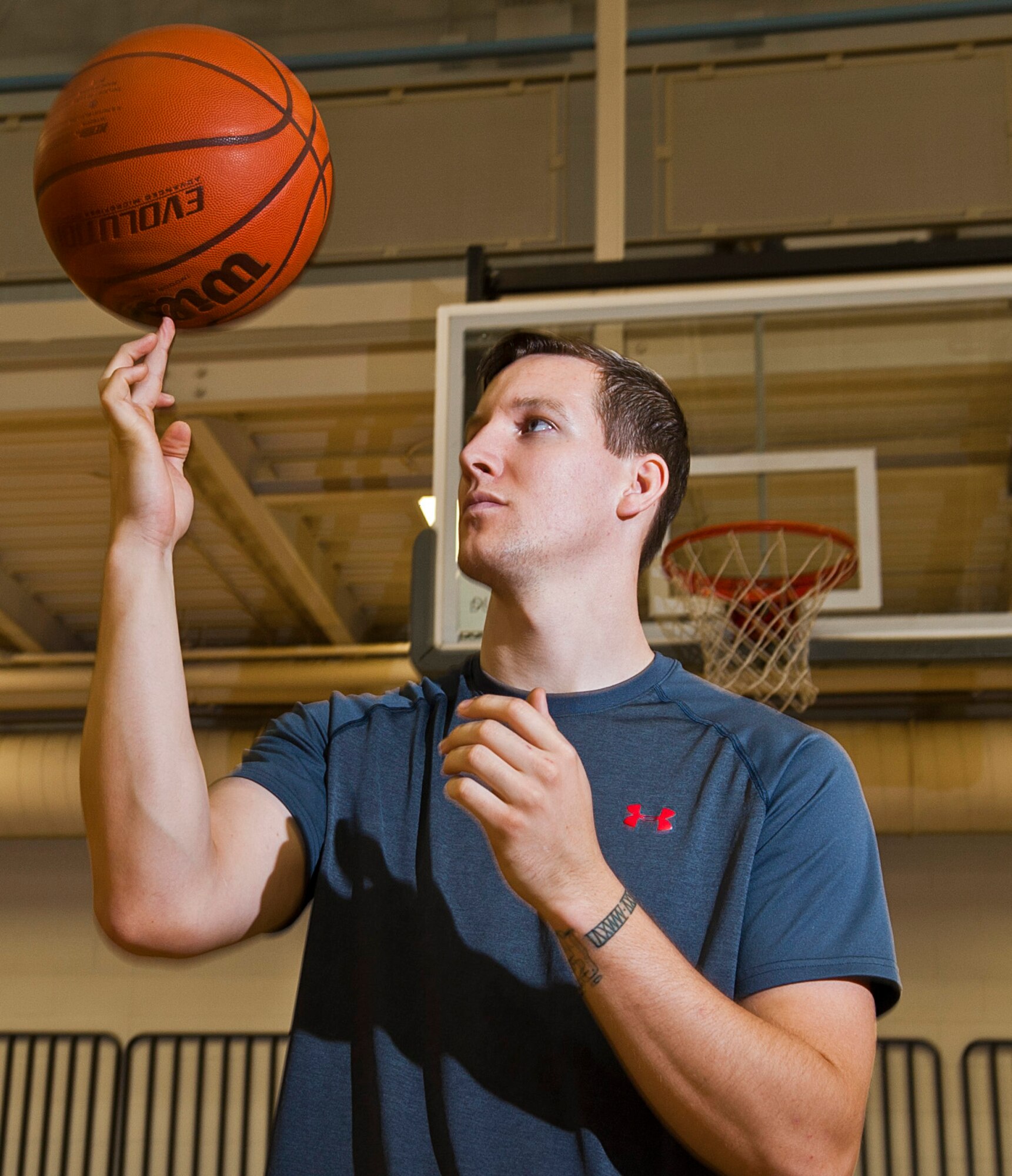 Airman 1st Class Cody Sluder, 791st Missile Security Forces Squadron member, spins a basketball on his finger at Minot Air Force Base, N.D., Oct. 15, 2016. Sluder was one of 27 Airmen selected to attend the 2016 All-Air Force men's basketball team trial camp at Joint Base San Antonio-Lackland, Texas. (U.S. Air Force photo/Airman 1st Class Jonathan McElderry)