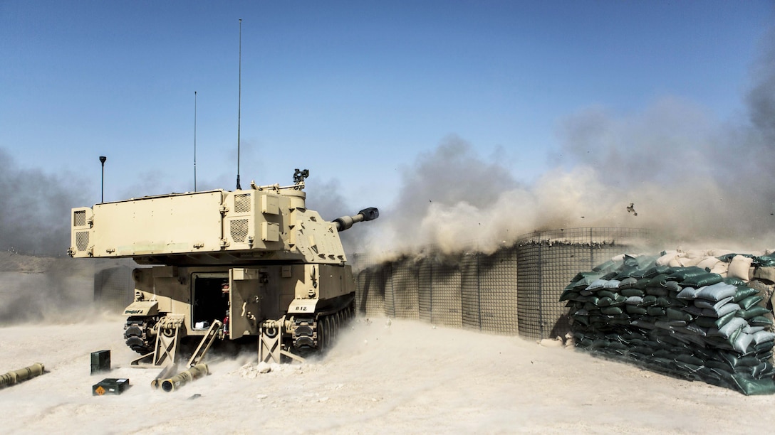 U.S. Army Soldiers with Battery C, 4th Battalion, 1st Field Artillery Regiment, 1st Armored Division, Task Force Al Taqaddum, fire an M109A6 Paladin howitzer during a fire mission at Al Taqaddum Air Base, Iraq, June 27, 2016. The strikes were conducted in support of Operation Inherent Resolve, the operation aimed at eliminating the Islamic State of Iraq and the Levant, and the threat they pose to Iraq, Syria, and the wider international community. The destruction of ISIL targets in Iraq further limits the group's ability to project terror and conduct operations. (U.S. Marine Corps photo by Sgt. Donald Holbert/ Released)