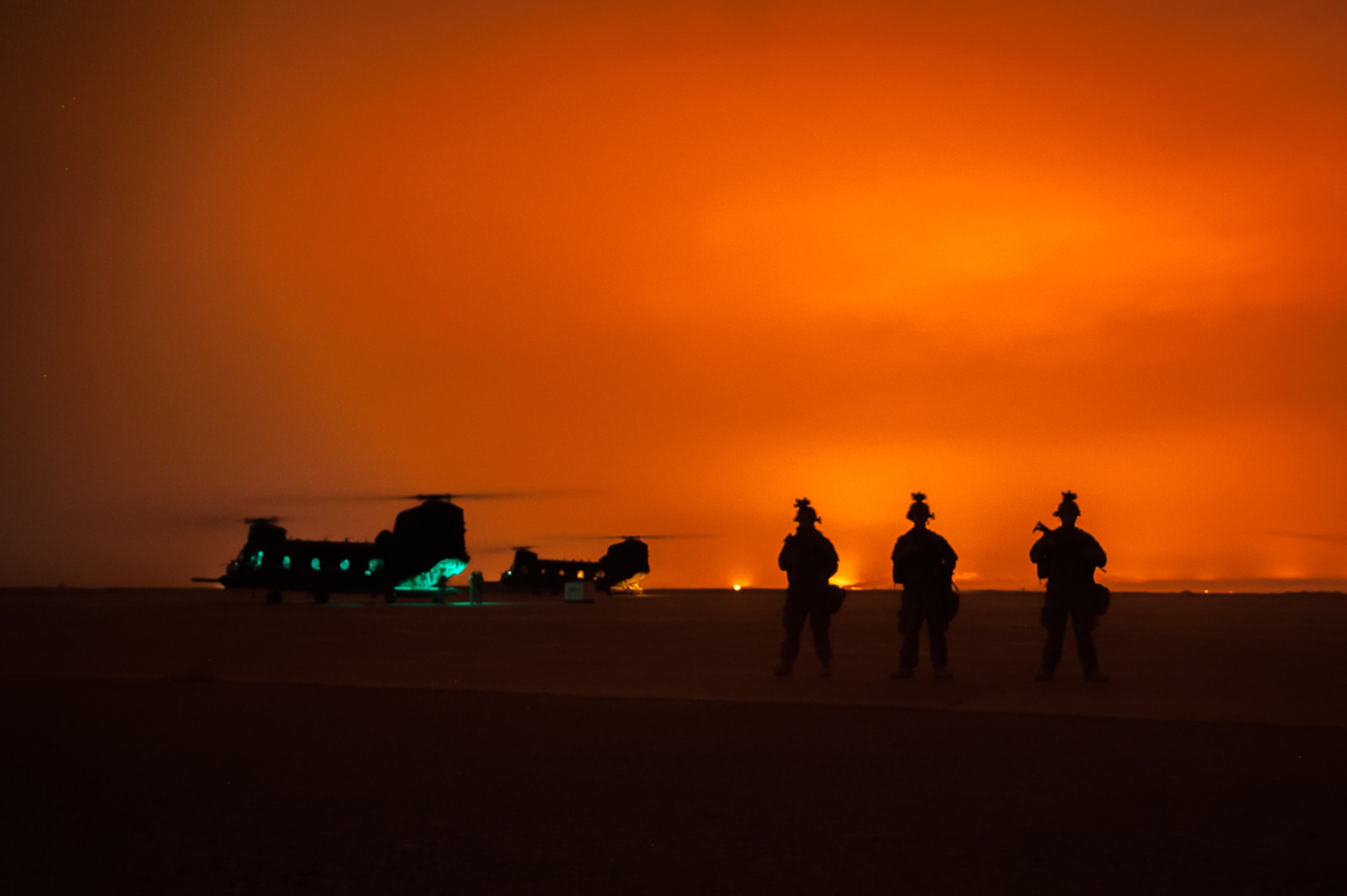 Airmen assigned to the 821st Contingency Response Group stand watch on the flightline at Qyarrayah West airfield, Oct. 28, 2016. Airmen assigned to the 821st CRG recently arrived to Q-West to conduct air base opening operations in order to enable follow on mobility air forces assets. As Air Mobility Command’s contingency response experts, 821st CRG Airmen are providing the crucial role of sustaining coalition and Iraq forces conducting counter-Da’esh operations in Mosul. (U.S. Air Force photo by Staff Sgt. Adam Kern)