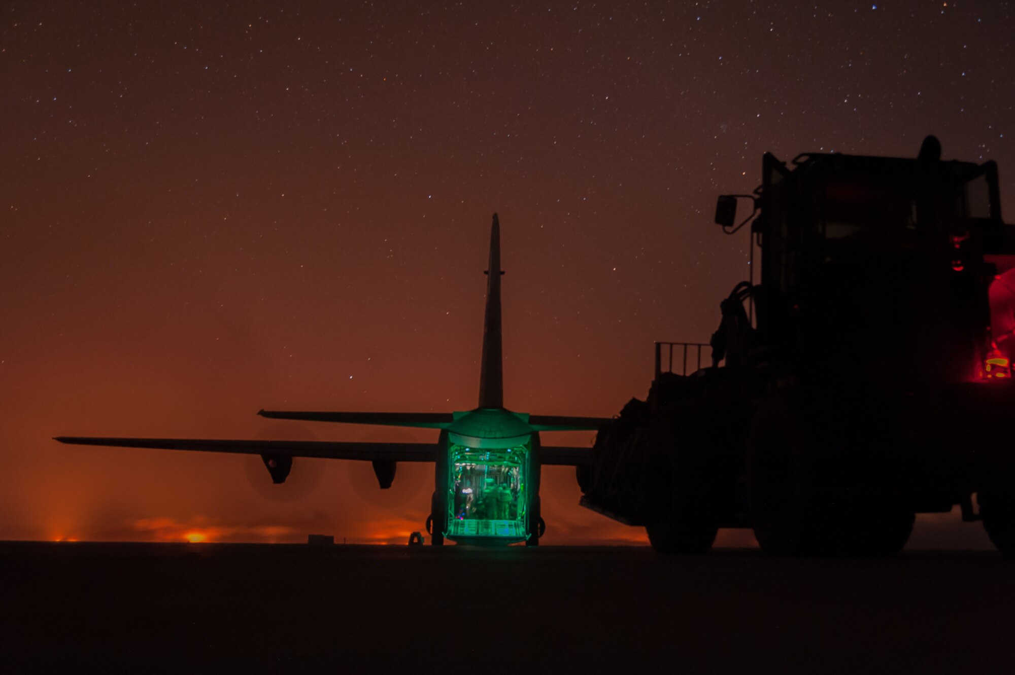 Airmen assigned to the 821st Contingency Response Group offload cargo from a C-130J Super Hercules at Qyarrayah West airfield, Oct. 28, 2016. The 821st CRG provides the core cadre of expeditionary command and control, airlift and air refueling operations, aerial port, and aircraft maintenance personnel for deployment worldwide as mobility control teams and airfield assessments teams. (U.S. Air Force photo by Staff Sgt. Adam Kern)
