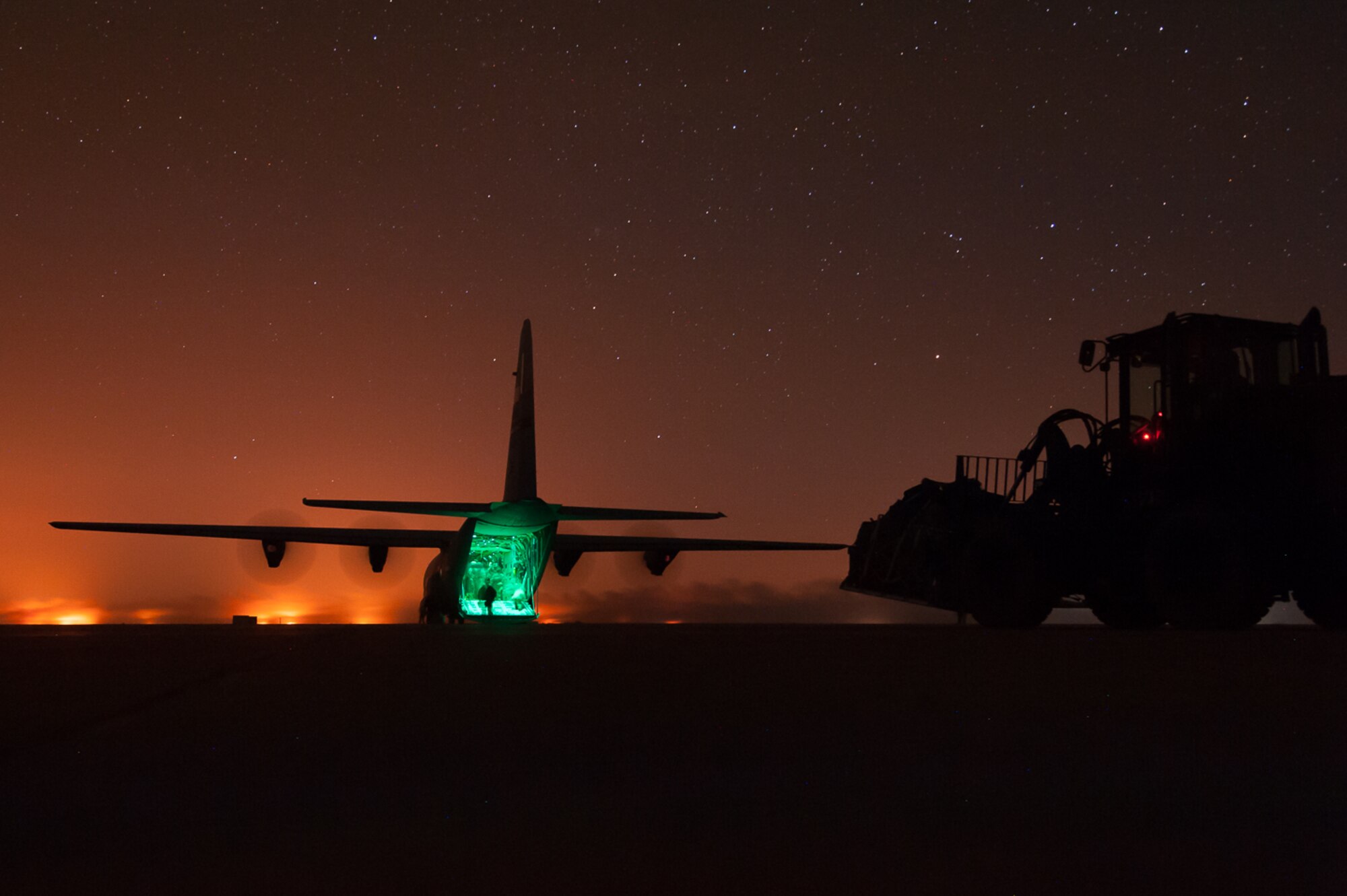 Airmen assigned to the 821st Contingency Response Group offload cargo from a C-130J Super Hercules at Qyarrayah West airfield, Oct. 28, 2016. The 821st CRG provides the core cadre of expeditionary command and control, airlift and air refueling operations, aerial port, and aircraft maintenance personnel for deployment worldwide as mobility control teams and airfield assessments teams. (U.S. Air Force photo by Staff Sgt. Adam Kern)