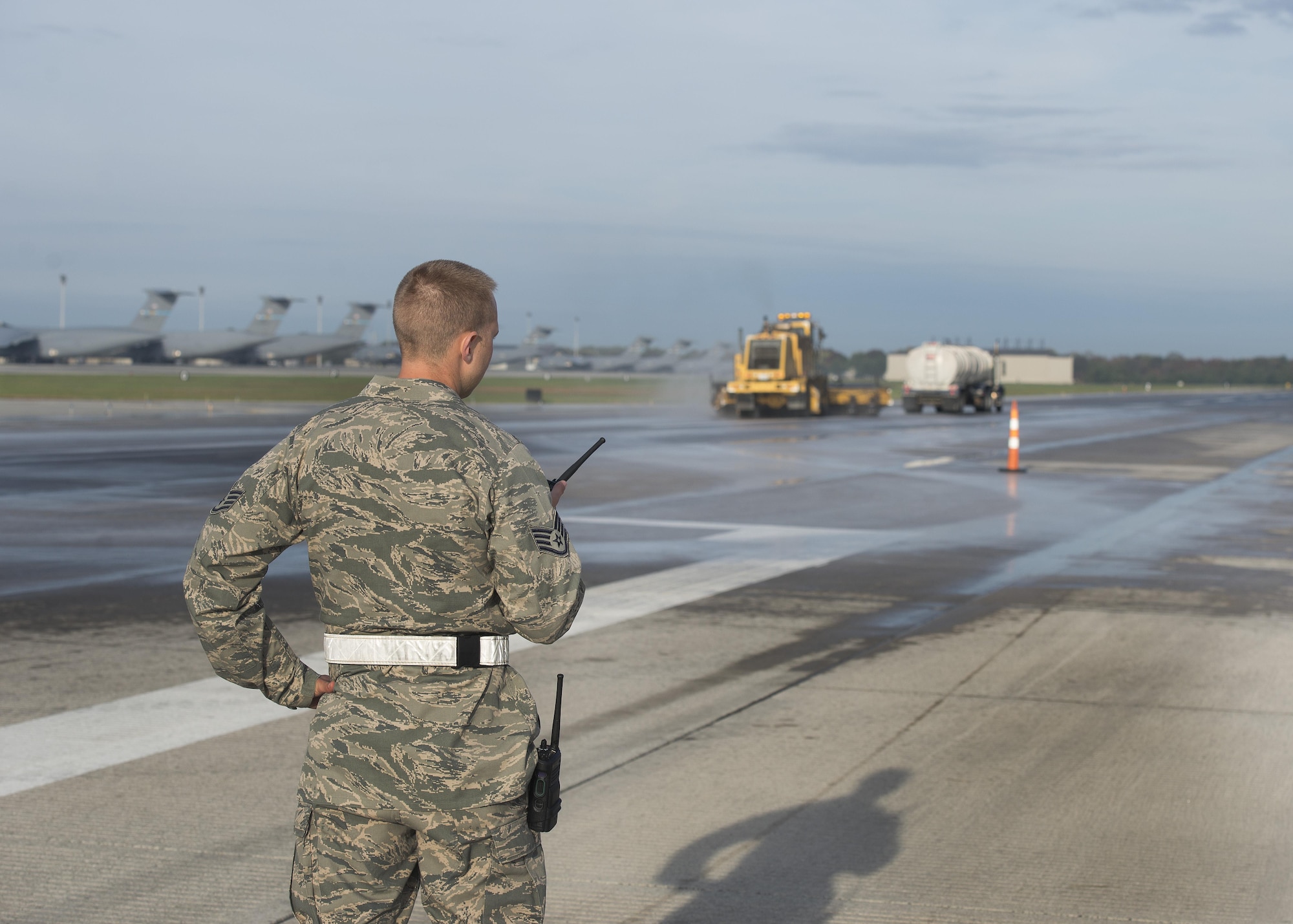 Staff Sgt. Patrick Murphy, 436th Civil Engineer Squadron Heavy Repairs Flight pavements and construction equipment operator, oversees rubber removal operations on Runway 14-32 Nov. 1, 2016, at Dover Air Force Base, Del. Murphy and seven other ‘Dirt Boys’ were out on the runway from 6 a.m. until the early evening completing the appropriate tasks necessary to safely and effectivity remove the built up rubber residue. (U.S. Air Force photo by Senior Airman Zachary Cacicia)