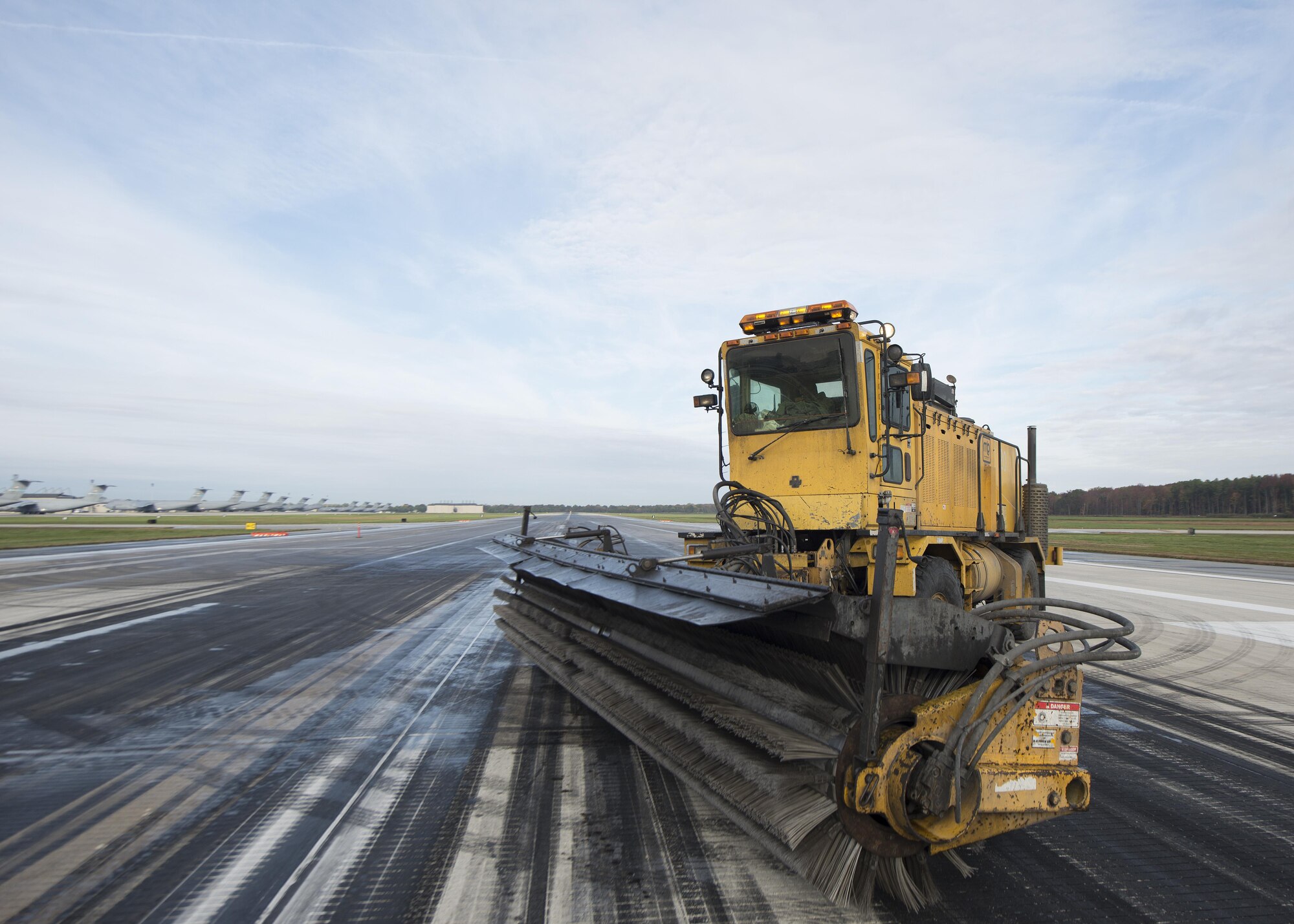 An Oshkosh Snow Broom sits on Runway 14-32 during rubber removal operations Nov. 1, 2016, at Dover Air Force Base, Del. Rubber removal operations are conducted at Dover AFB every six months to ensure the safety of flight operations. (U.S. Air Force photo by Senior Airman Zachary Cacicia)