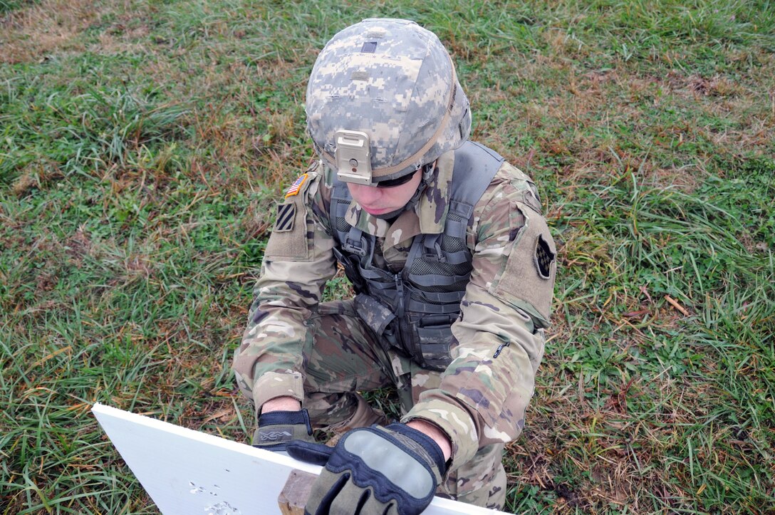 Sgt. David Graves, a public affairs broadcast specialist from Nashville, Tennessee assigned to the U.S. Army Reserve’s 372nd Mobile Public Affairs Detachment, marks his zero grouping Nov. 3 at Camp Atterbury, Indiana.  Army Reserve Soldiers qualify on their individual assigned weapon once a year in order to be “mission capable” should they need to deploy.