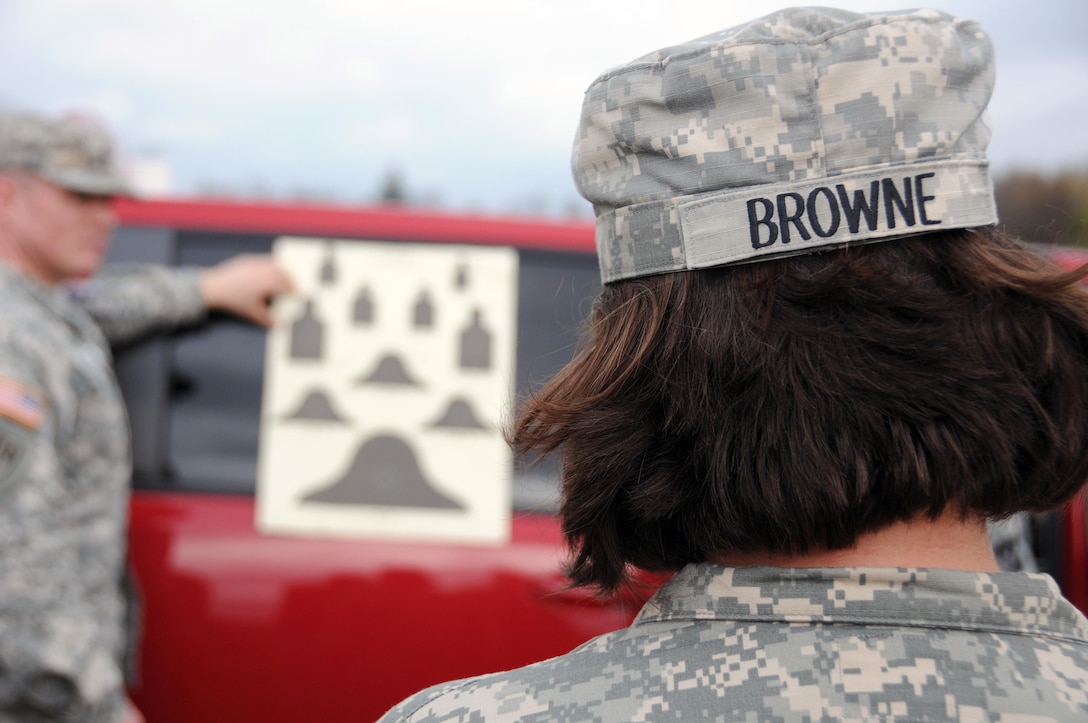 Sgt. Kimberly Browne, a public affairs specialist from Morgantown, Indiana assigned to the U.S. Army Reserve’s 350th Public Affairs Detachment, receives instructions prior to going onto the range at Camp Atterbury, Indiana Nov. 3.  Army Reserve Soldiers qualify on their individual assigned weapon once a year in order to be “mission capable” should they need to deploy.