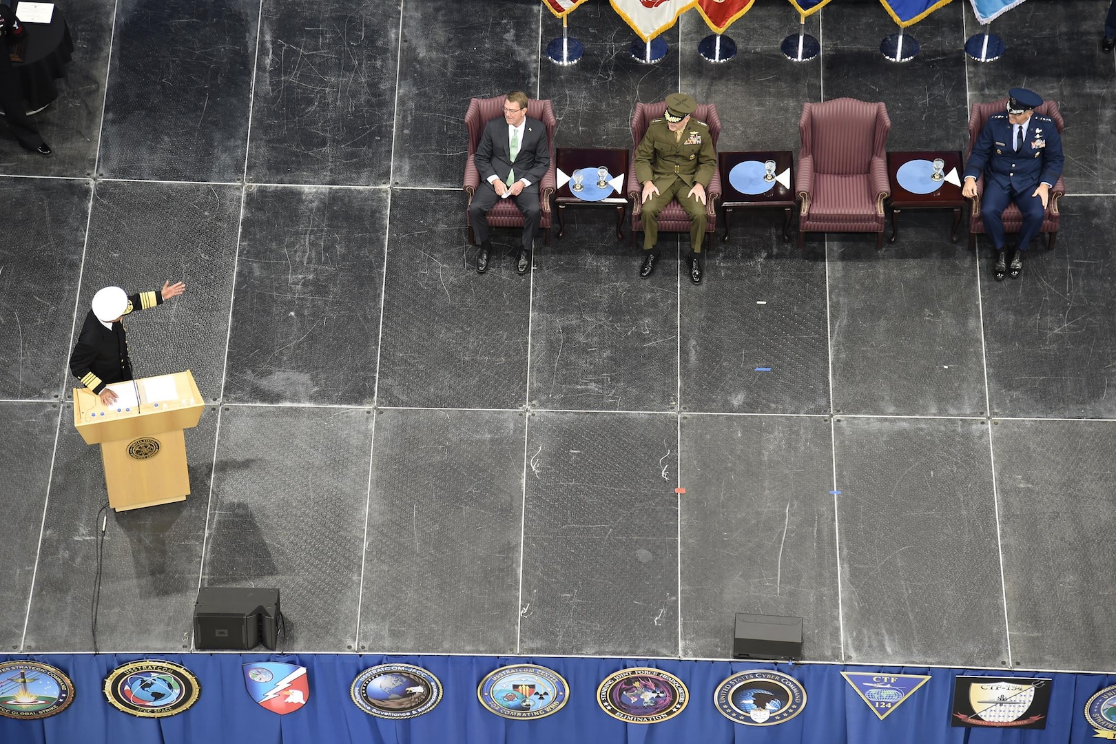 Adm. Cecil D. Haney, outgoing U.S. Strategic Command (USSTRATCOM) commander, speaks to Secretary of Defense Ash Carter, Chairman of the Joint Chiefs of Staff, Gen. Joseph Dunford and Gen. John E. Hyten, incoming USSTRATCOM commander, at USSTRATCOM's change of command ceremony at Offutt Air Force Base, Neb., Nov. 3, 2016. Carter presided over the change of command and provided remarks during which he thanked Adm. Cecil D. Haney, outgoing USSTRATCOM commander, for his service. He also congratulated Gen. John E. Hyten on his appointment as the new USSTRATCOM commander. Additionally, Chairman of the Joint Chiefs of Staff Gen. Joseph F. Dunford provided remarks during the ceremony and presented the Joint Meritorious Unit Award to USSTRATCOM. Hyten previously served as commander of Air Force Space Command, and Haney will retire from active military duty during a separate ceremony in January. One of nine DoD unified combatant commands, USSTRATCOM has global strategic missions assigned through the Unified Command Plan that include strategic deterrence; space operations; cyberspace operations; joint electronic warfare; global strike; missile defense; intelligence, surveillance and reconnaissance; combating weapons of mass destruction; and analysis and targeting. (U.S. Navy photo by Petty Officer 1st Class Byron C. Linder)