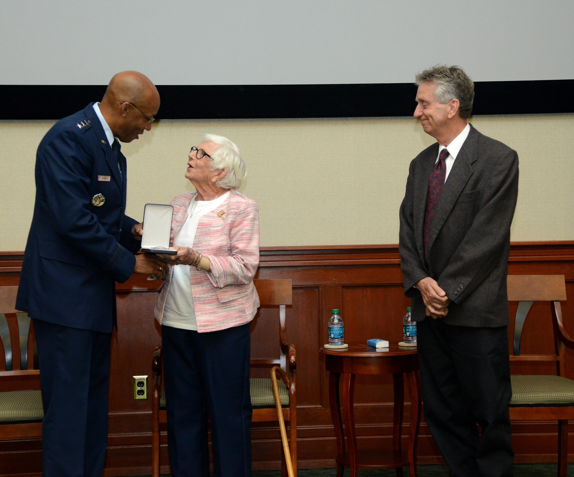 Lieutenant General Charles Q. Brown Jr., left, deputy director of operations at U.S. Central Command, presents the Silver Star Medal to the family of John Caraberis at MacDill Air Force Base Fla., Nov. 4, 2016. John Caraberis was awarded the Silver Star Medal posthumously for his heroic acts during his time in the Army Air Corps. 