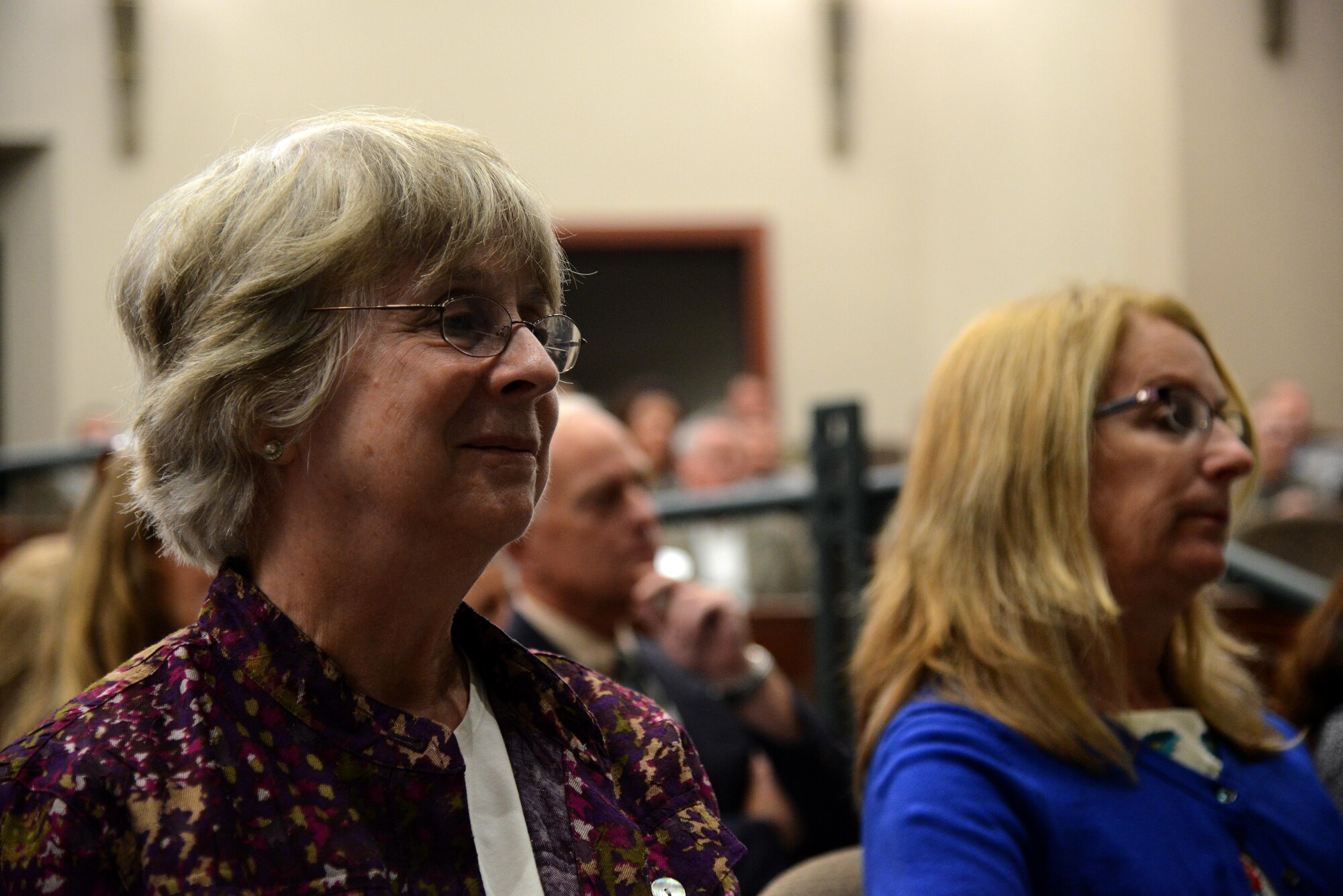 Peggy Caraberis, left, watches as her mother accepts the Silver Star Medal that was being posthumously awarded to her father John Caraberis at MacDill Air Force Base, Fla., Nov. 4, 2016. John Caraberis was awarded the Silver Star Medal for his heroic acts in service of the Army Air Corps. 
