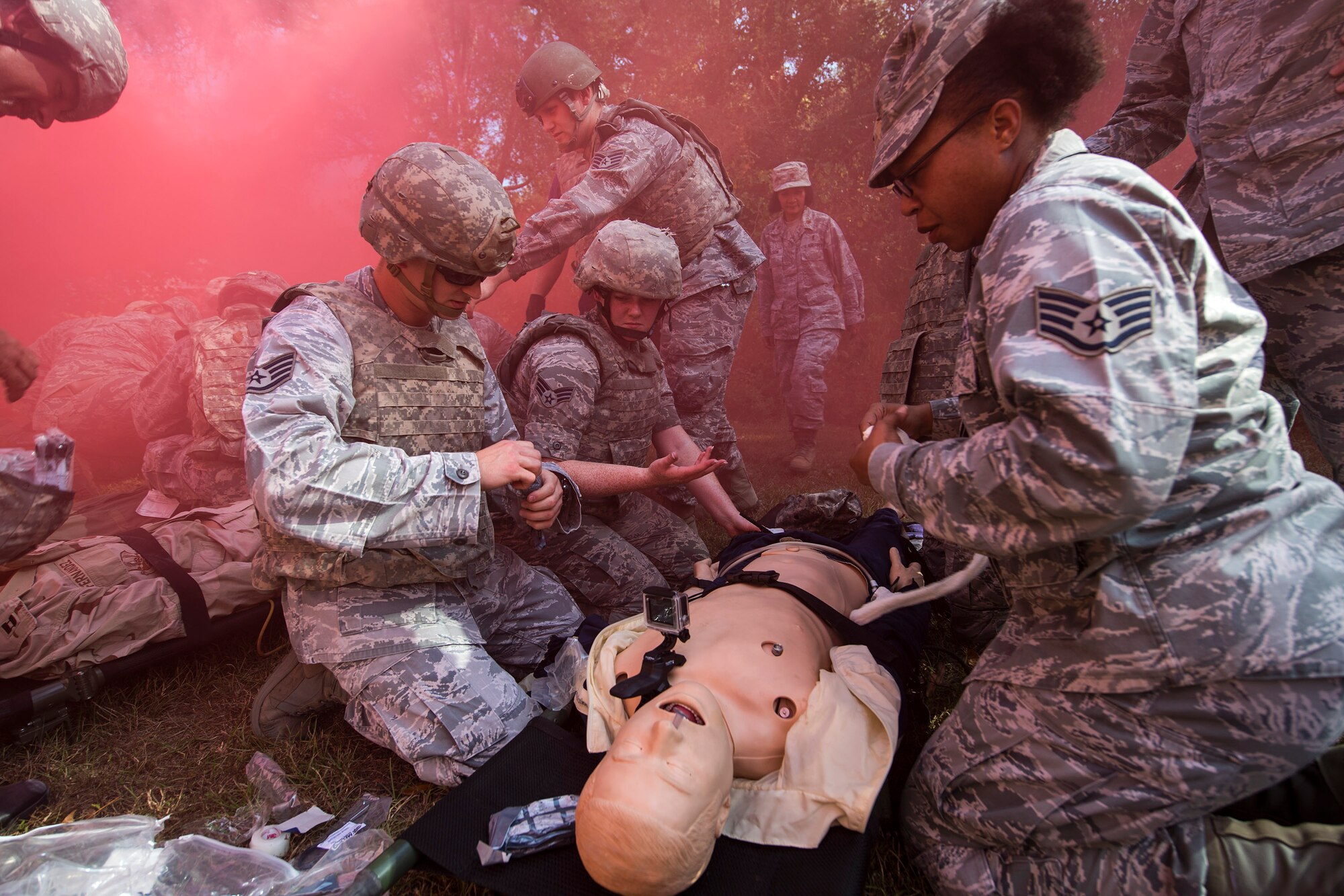 A team of medics treat a simulated casualty, during an Emergency Medical Technician refresher course, Nov. 4, 2016, at Moody Air Force Base, Ga. Medics prioritized transport for each patient based on the severity of their injuries. Team leads relayed the information about each patient to the evaluator which tested their ability to work and communicate as a team. (U.S. Air Force photo by Airman 1st Class Janiqua P. Robinson)