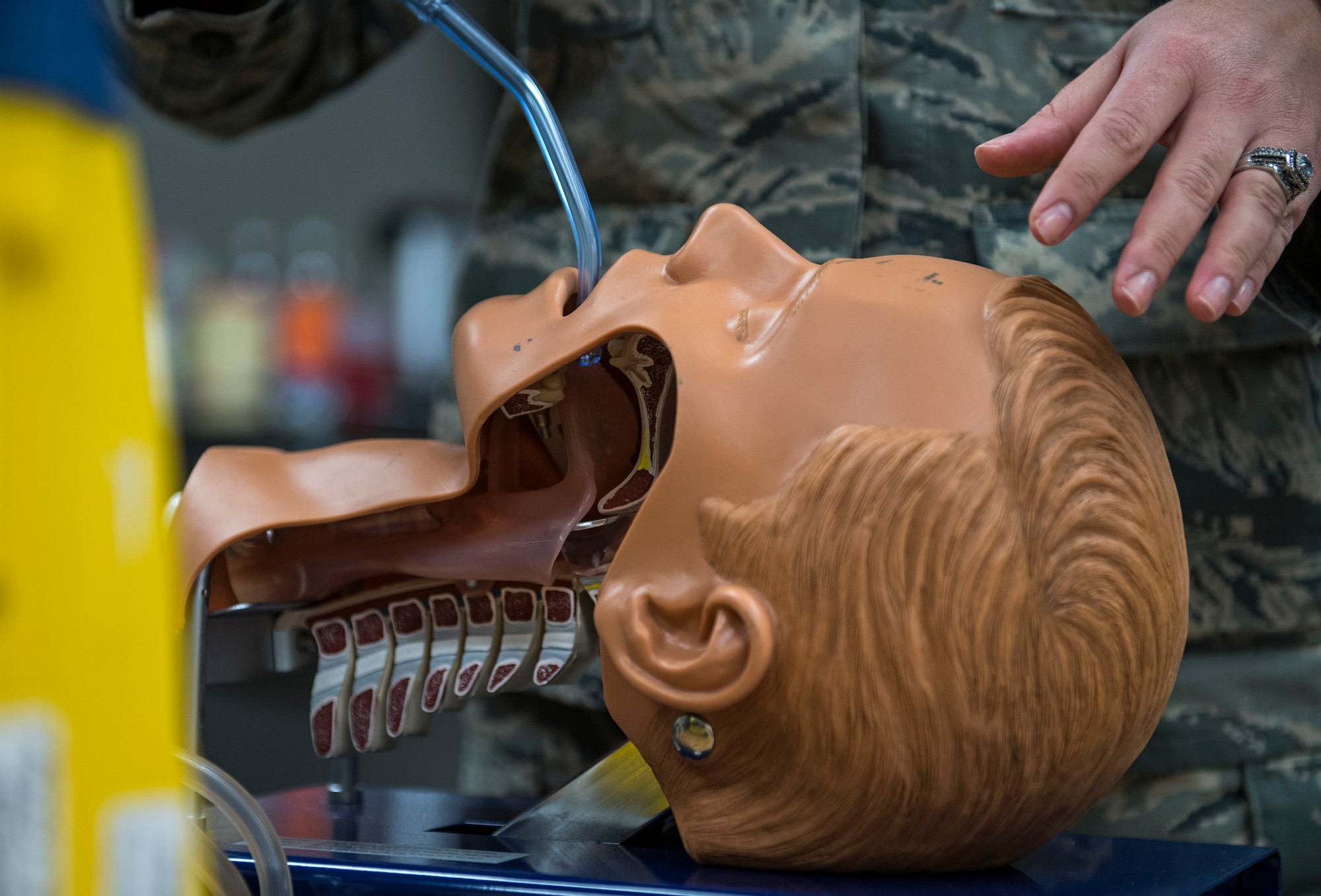 A student simulates clears a patient’s airway during an Emergency Medical Technician refresher course, Oct. 31, 2016, at Moody Air Force Base, Ga. In this scenario, students were tasked to use suction to remove anything obstructing the patient’s ability to breathe. (U.S. Air Force photo by Airman 1st Class Janiqua P. Robinson)