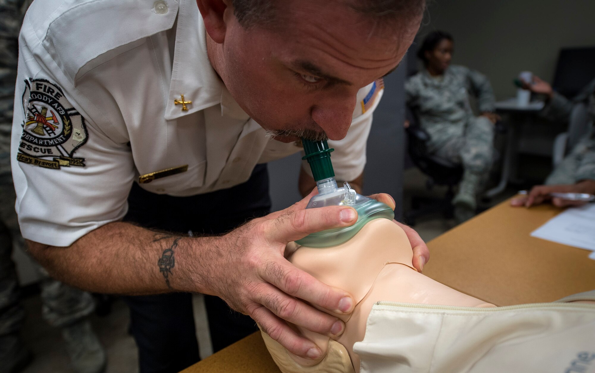 Stephen Wilmot, 23d Civil Engineer Squadron fire chief, performs CPR on a simulated patient during an Emergency Medical Technician refresher course, Oct. 31, 2016, at Moody Air Force Base, Ga. Wilmot used a jaw-thrust chin lift to ensure the patient was receiving the air. (U.S. Air Force photo by Airman 1st Class Janiqua P. Robinson)