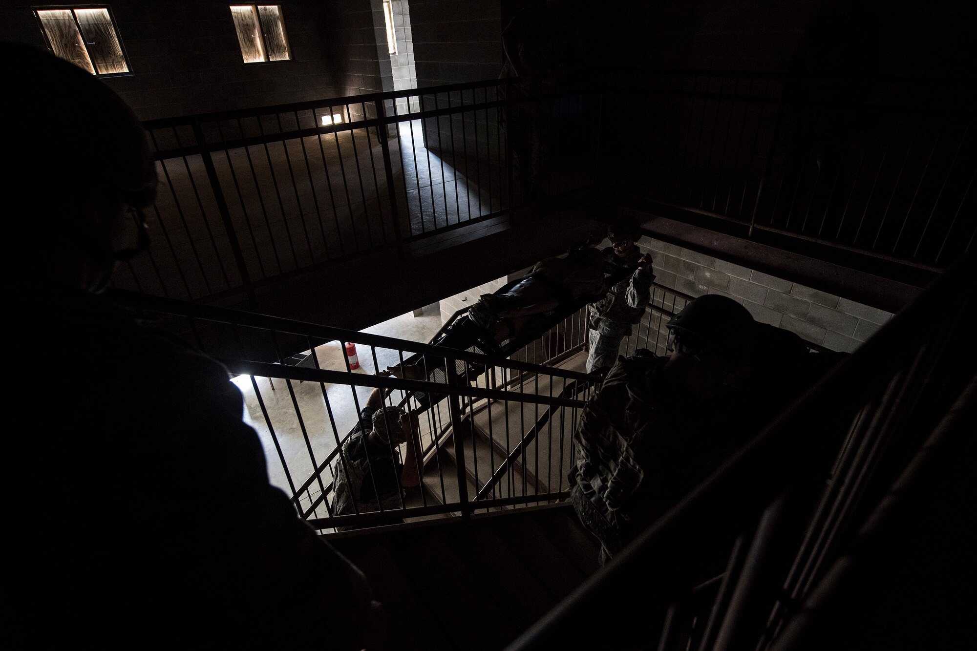 A team of medics evacuate simulated casualties after an attack, during an Emergency Medical Technician refresher course, Nov. 4, 2016, at Moody Air Force Base, Ga. The medics assessed the casualties on-scene and relayed the information to the treatment team waiting outside. (U.S. Air Force photo by Airman 1st Class Janiqua P. Robinson)