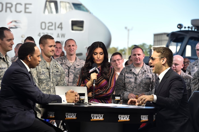 Max Kellerman, ESPN First Take co-host, Stephen A. Smith, ESPN First Take co-host, and Molly Qerim, ESPN First Take host, answers a question from an audience member here during First Take’s week of Veteran’s Day program, Nov. 7, 2016. Every year ESPN First Take honors service members near Veterans Day by telecasting their show from a different base and highlights service members who go above and beyond in their careers.