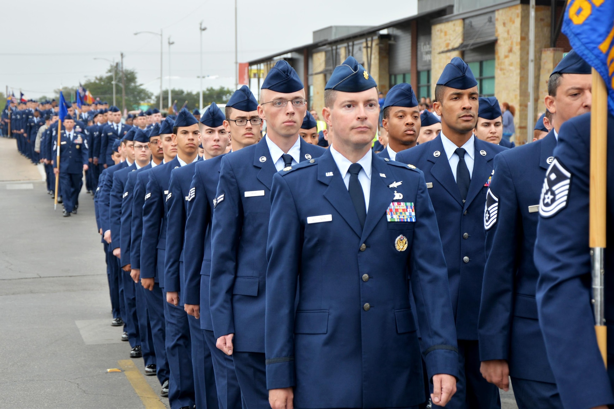 Goodfellow Air Force Base Airmen march in formation during the Veterans Day Parade in downtown San Angelo, Texas, Nov. 5, 2016. The parade featured veterans, active duty, marching bands and more. (U.S. Air Force photo by Airman 1st Class Randall Moose/Released)