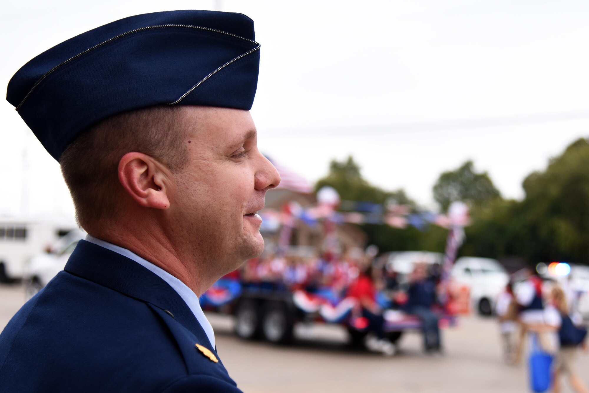 U.S. Air Force Maj. John Travieso, 17th Contracting Squadron Commander, watches the Veterans Day Parade in downtown San Angelo, Texas, Nov. 5, 2016. Travieso marched near the beginning of the parade and finished with enough time to watch the rest. (U.S. Air Force photo by Senior Airman Joshua Edwards/Released)