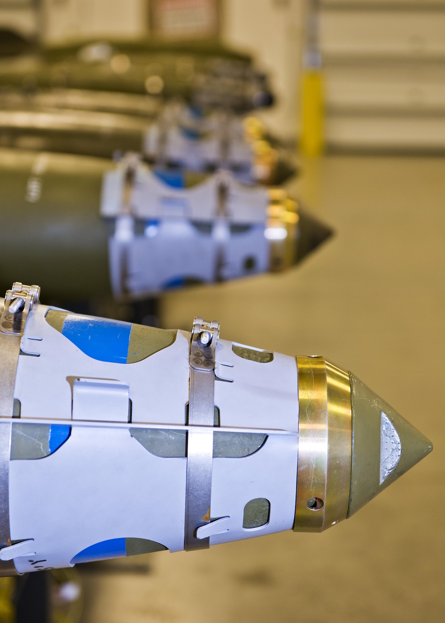 Four assembled GBU-38s line a bomb rack at Minot Air Force Base, N.D., Oct. 27, 2016. The 5th Munitions Squadron is responsible for assembling, testing and inspecting conventional munitions for the 5th Bomb Wing’s B-52H Stratofortresses. (U.S. Air Force photo/Airman 1st Class J.T. Armstrong)
