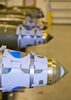 Four assembled GBU-38s line a bomb rack at Minot Air Force Base, N.D., Oct. 27, 2016. The 5th Munitions Squadron is responsible for assembling, testing and inspecting conventional munitions for the 5th Bomb Wing’s B-52H Stratofortresses. (U.S. Air Force photo/Airman 1st Class J.T. Armstrong)