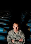 Airman 1st Class Josh DeSpain, 5th Munitions Squadron conventional maintenance crew member, stands between two rows of inert BDU-50 bombs at Minot Air Force Base, N.D., Nov. 2, 2016.  DeSpain was recognized by his squadron leadership with the 5 MUNS Own It Award, for consistent hard work and leadership capabilities. (U.S. Air Force photo/Airman 1st Class J.T. Armstrong)