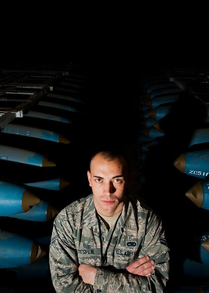Airman 1st Class Josh DeSpain, 5th Munitions Squadron conventional maintenance crew member, stands between two rows of inert BDU-50 bombs at Minot Air Force Base, N.D., Nov. 2, 2016.  DeSpain was recognized by his squadron leadership with the 5 MUNS Own It Award, for consistent hard work and leadership capabilities. (U.S. Air Force photo/Airman 1st Class J.T. Armstrong)