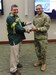 Lt. Gen. Michael Garrett, U.S. Army Central, commanding general (right) gives Zan Tracy Pender, Lexington School District One director of counseling and advisement, director, a token of appreciation from the unit for his presentation during the National Native American Heritage Month observance, Nov. 3, at Patton Hall located at Shaw Air Force Base, S.C. 