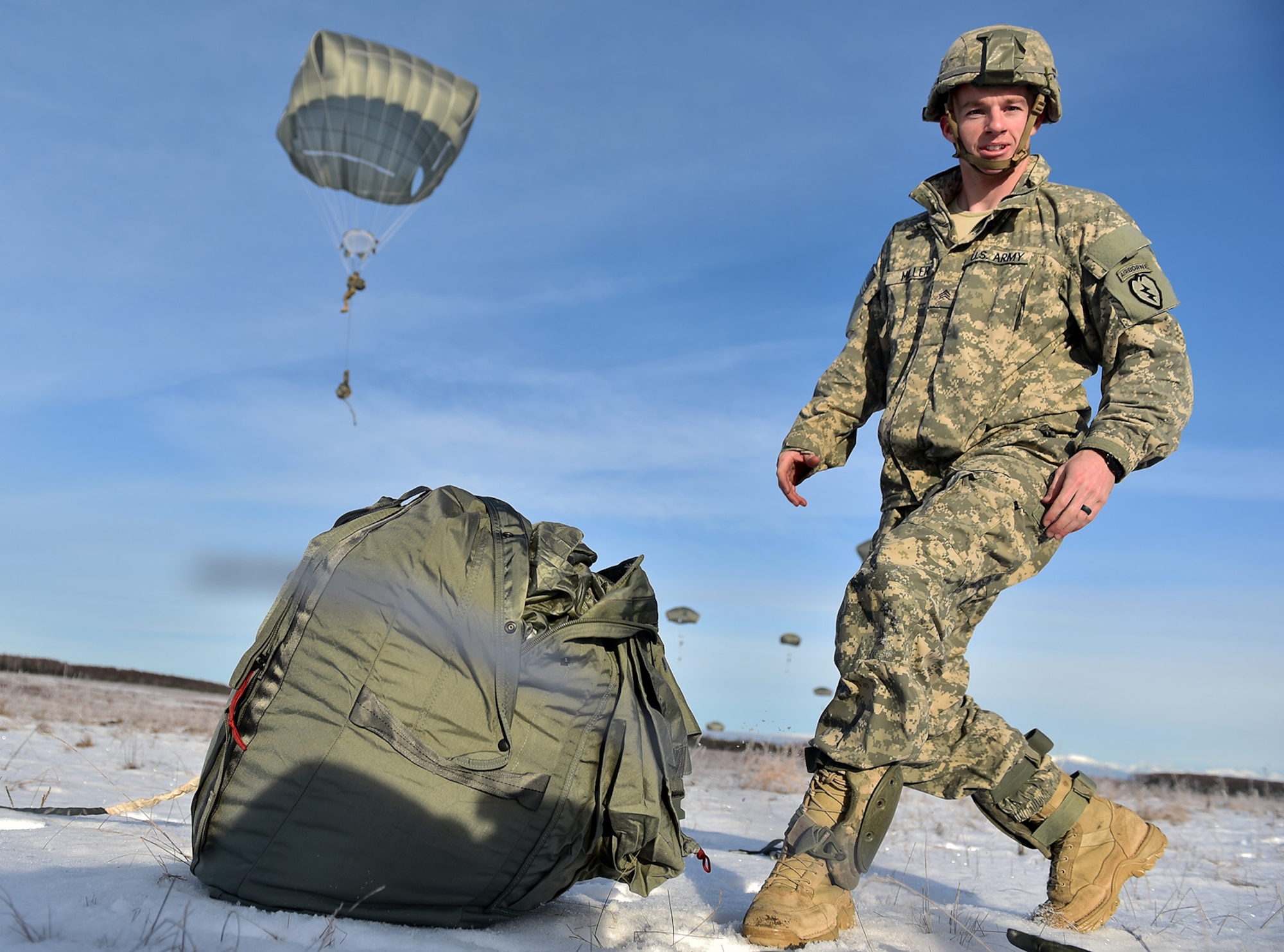 U.S. Army Sgt. Shane Miller, a native of Mission Viejo, Calif., assigned to Charlie Troop, 1st Squadron (Airborne), 40th Cavalry Regiment, 4th Infantry Brigade Combat Team (Airborne), 25th Infantry Division, U.S. Army Alaska, gathers his equipment after executing an airborne training jump from a CH-47 Chinook helicopter on Malemute drop zone at Joint Base Elmendorf-Richardson, Alaska, Thursday, Nov. 3, 2016. The Soldiers of 4/25 IBCT belong to the only American airborne brigade in the Pacific and are trained to execute airborne maneuvers in extreme cold weather/high altitude environments in support of combat, partnership and disaster relief operations.