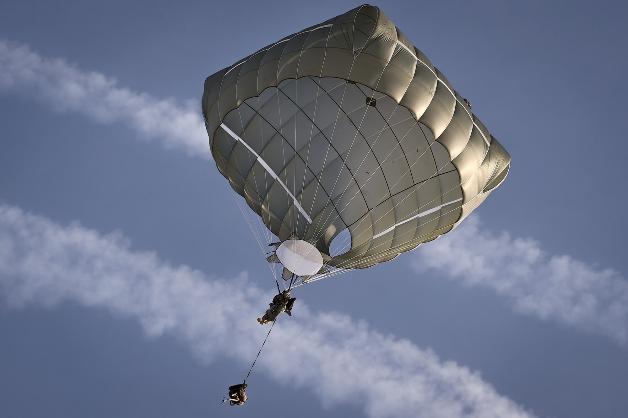 A U.S. Army paratrooper assigned to the 4th Infantry Brigade Combat Team (Airborne), 25th Infantry Division, U.S. Army Alaska, prepares to land during an airborne training jump from a CH-47 Chinook helicopter on Malemute drop zone at Joint Base Elmendorf-Richardson, Alaska, Thursday, Nov. 3, 2016. The Soldiers of 4/25 IBCT belong to the only American airborne brigade in the Pacific and are trained to execute airborne maneuvers in extreme cold weather/high altitude environments in support of combat, partnership and disaster relief operations. 