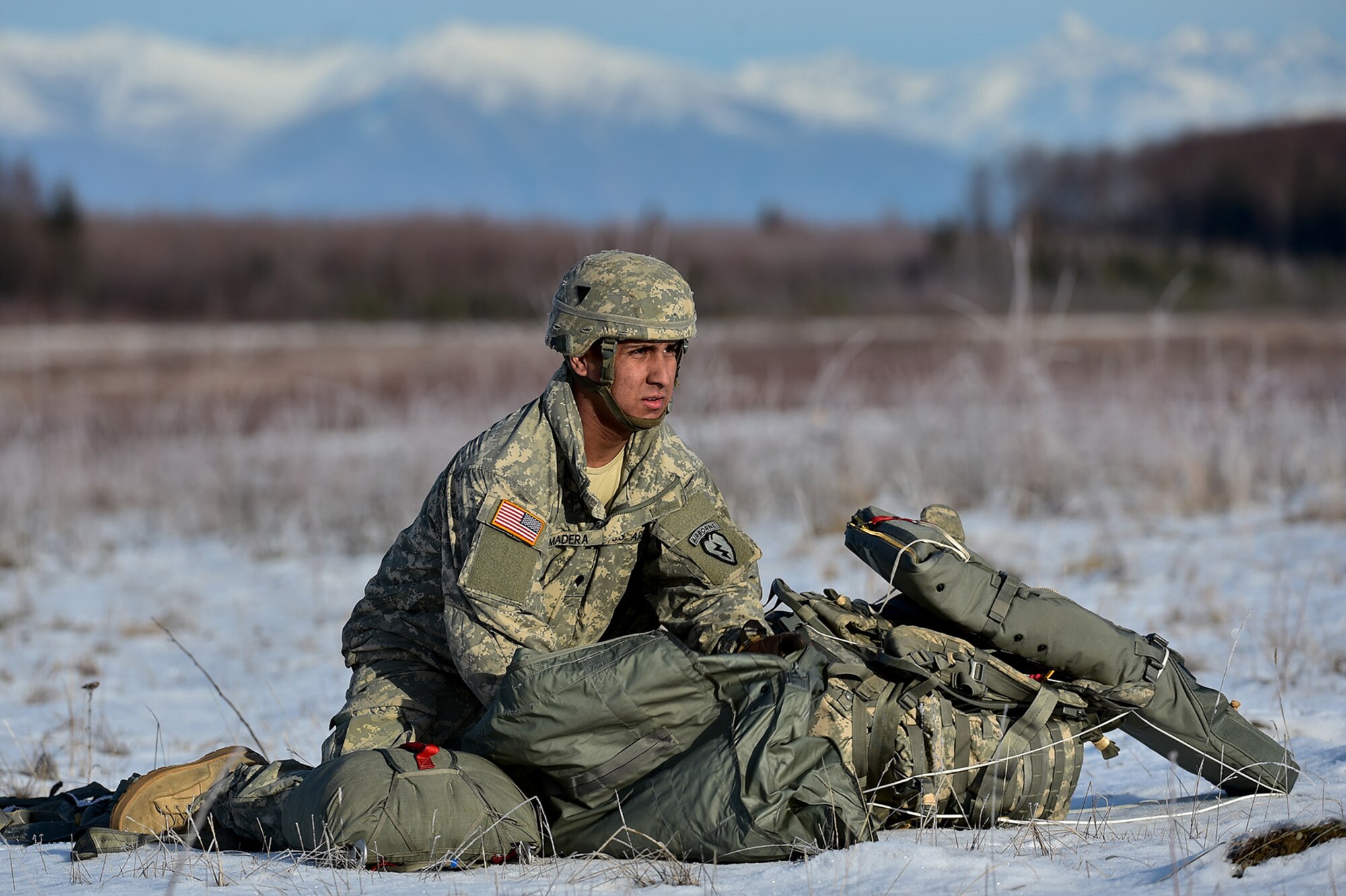 Spc. Wesley Madera-Lopez, a native of Long Beach, Calif., assigned to B Company, 6th Brigade Engineer Battalion (Airborne), 4th Infantry Brigade Combat Team (Airborne), 25th Infantry Division, U.S. Army Alaska, packs up his equipment after an airborne training jump from a CH-47 Chinook helicopter on Malemute drop zone at Joint Base Elmendorf-Richardson, Alaska, Thursday, Nov. 3, 2016. The Soldiers of 4/25 IBCT belong to the only American airborne brigade in the Pacific and are trained to execute airborne maneuvers in extreme cold weather/high altitude environments in support of combat, partnership and disaster relief operations. 