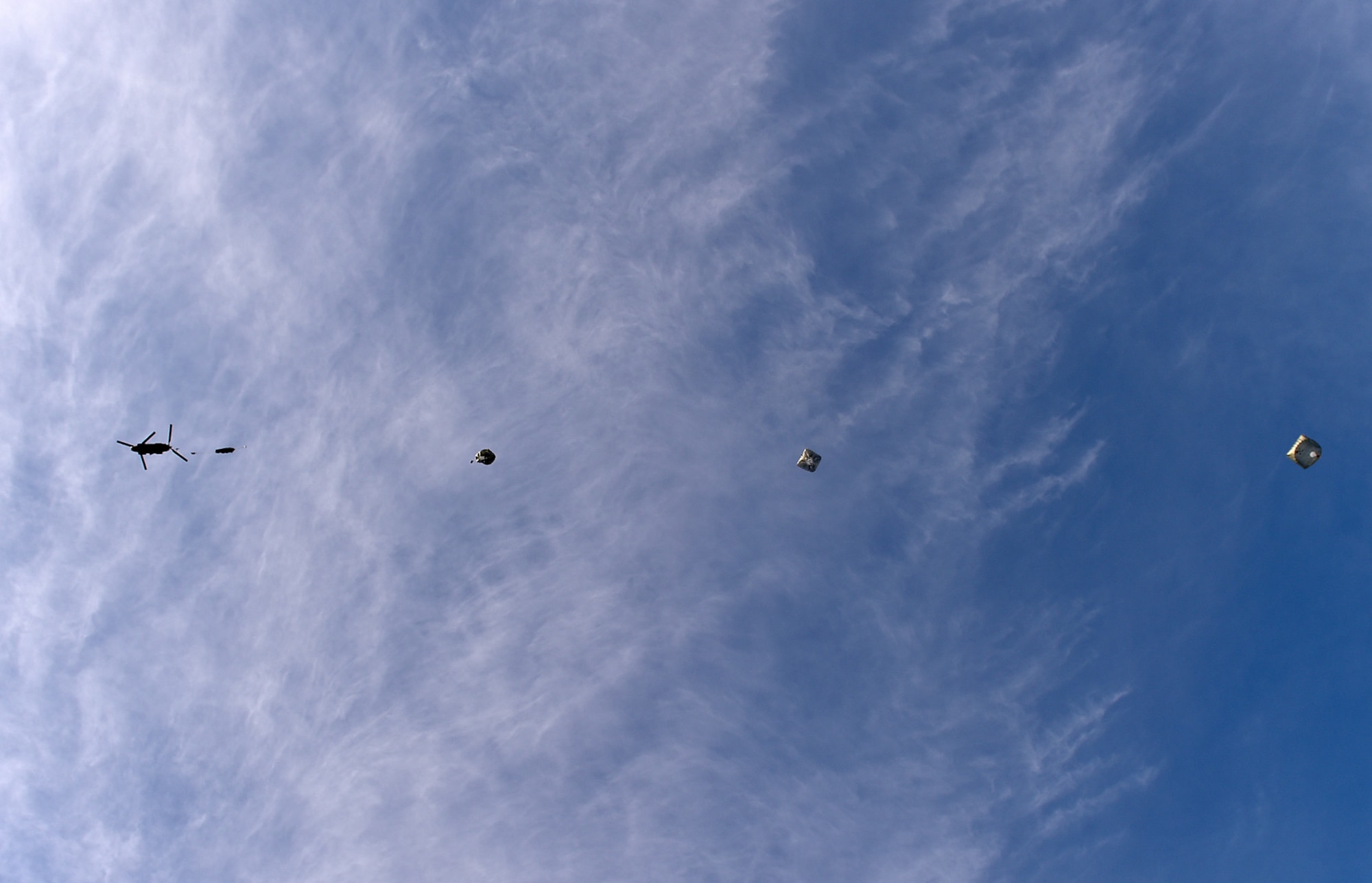 U.S. Army paratroopers assigned to the 4th Infantry Brigade Combat Team (Airborne), 25th Infantry Division, U.S. Army Alaska, execute an airborne training jump from a CH-47 Chinook helicopter on Malemute drop zone at Joint Base Elmendorf-Richardson, Alaska, Thursday, Nov. 3, 2016. The Soldiers of 4/25 IBCT belong to the only American airborne brigade in the Pacific and are trained to execute airborne maneuvers in extreme cold weather/high altitude environments in support of combat, partnership and disaster relief operations. 