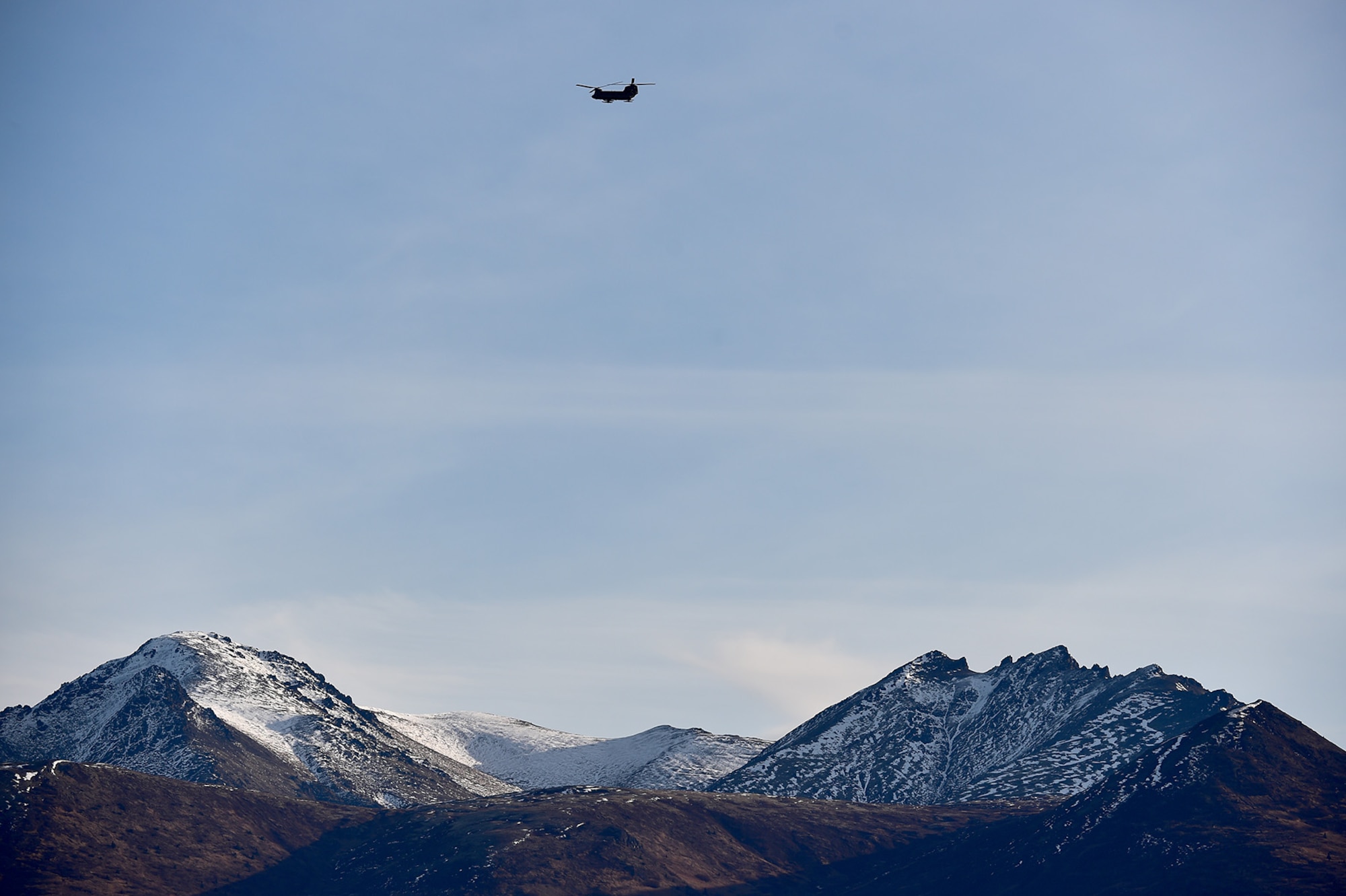 A CH-47 Chinook helicopter ladened with U.S. Army paratroopers assigned to the 4th Infantry Brigade Combat Team (Airborne), 25th Infantry Division, U.S. Army Alaska, approach Malemute drop zone to execute an airborne training jump at Joint Base Elmendorf-Richardson, Alaska, Thursday, Nov. 3, 2016. The Soldiers of 4/25 IBCT belong to the only American airborne brigade in the Pacific and are trained to execute airborne maneuvers in extreme cold weather/high altitude environments in support of combat, partnership and disaster relief operations. 