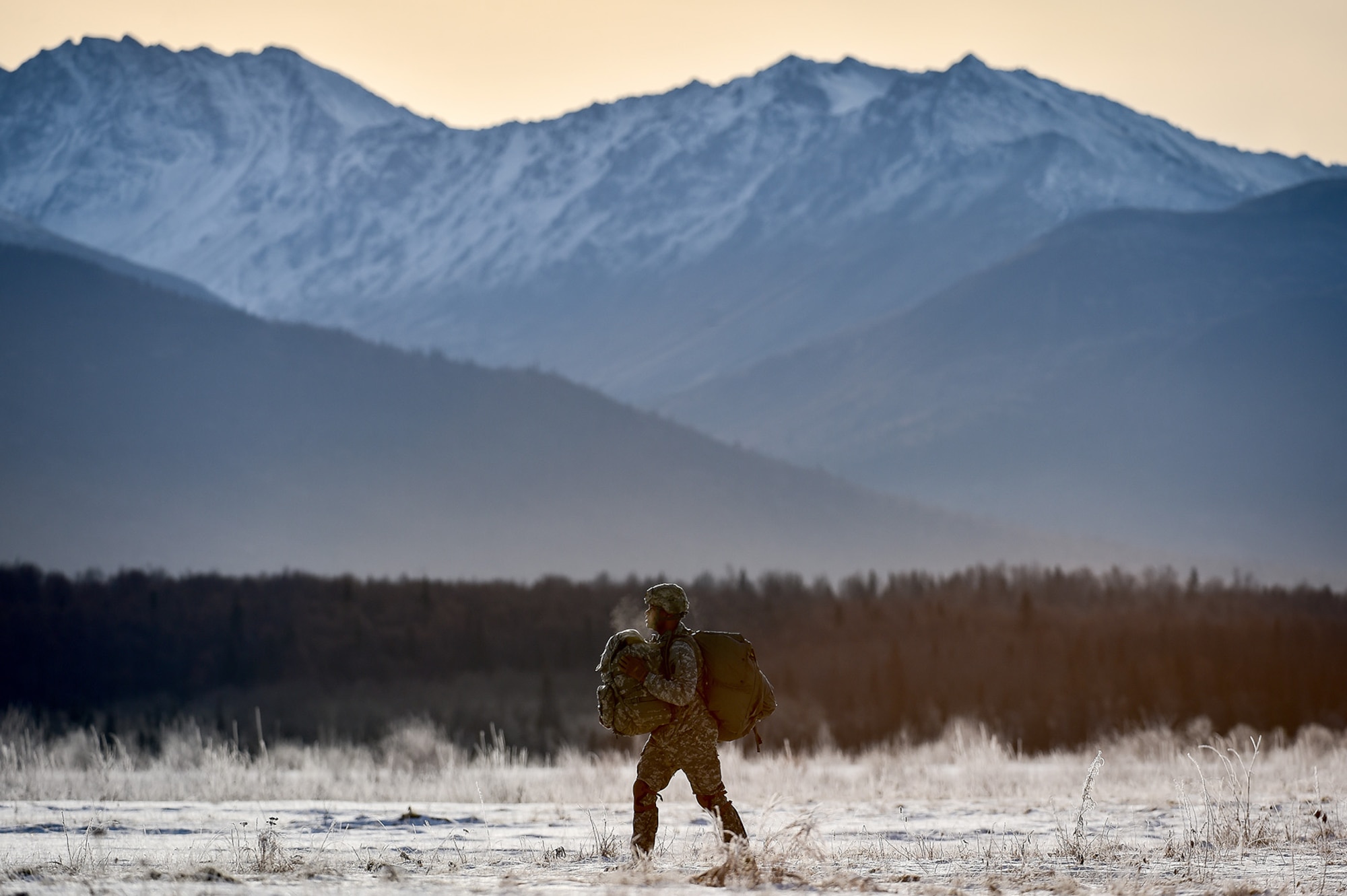 A U.S. Army paratrooper assigned to the 4th Infantry Brigade Combat Team (Airborne), 25th Infantry Division, U.S. Army Alaska, makes his way toward a parachute collection point after an airborne training jump from a CH-47 Chinook helicopter on Malemute drop zone at Joint Base Elmendorf-Richardson, Alaska, Thursday, Nov. 3, 2016. The Soldiers of 4/25 IBCT belong to the only American airborne brigade in the Pacific and are trained to execute airborne maneuvers in extreme cold weather/high altitude environments in support of combat, partnership and disaster relief operations. 