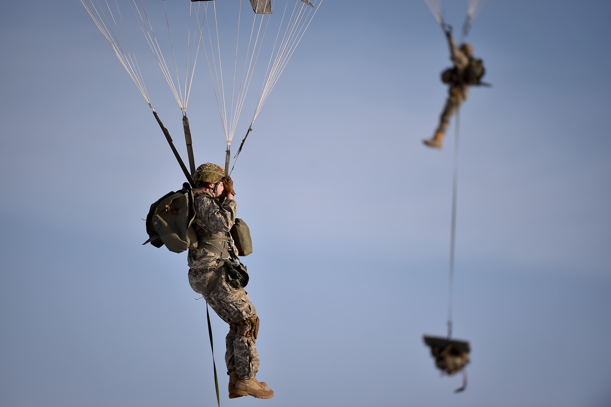 U.S. Army paratroopers assigned to the 4th Infantry Brigade Combat Team (Airborne), 25th Infantry Division, U.S. Army Alaska, prepare to land while executing an airborne training jump from a CH-47 Chinook helicopter on Malemute drop zone at Joint Base Elmendorf-Richardson, Alaska, Thursday, Nov. 3, 2016. The Soldiers of 4/25 IBCT belong to the only American airborne brigade in the Pacific and are trained to execute airborne maneuvers in extreme cold weather/high altitude environments in support of combat, partnership and disaster relief operations. 
