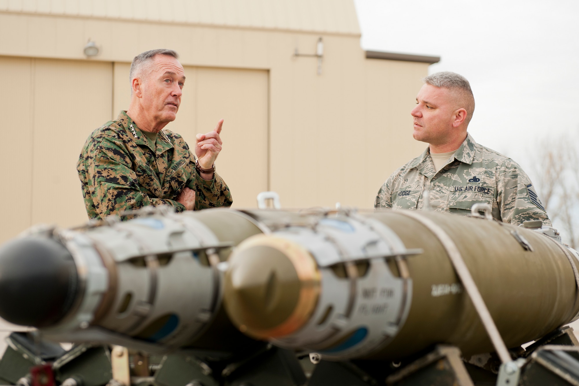 U.S. Marine Corps Gen. Joseph Dunford, chairman of the Joint Chiefs of Staff, speaks to Master Sgt. Daniel Hodge, 5th Aircraft Maintenance Squadron weapons section chief, at Minot Air Force Base, N.D., Nov. 2, 2016. Dunford visited Airmen and spoke about the importance of maintaining a competitive advantage over our adversaries. (U.S. Air Force photo/Airman 1st Class J.T. Armstrong)