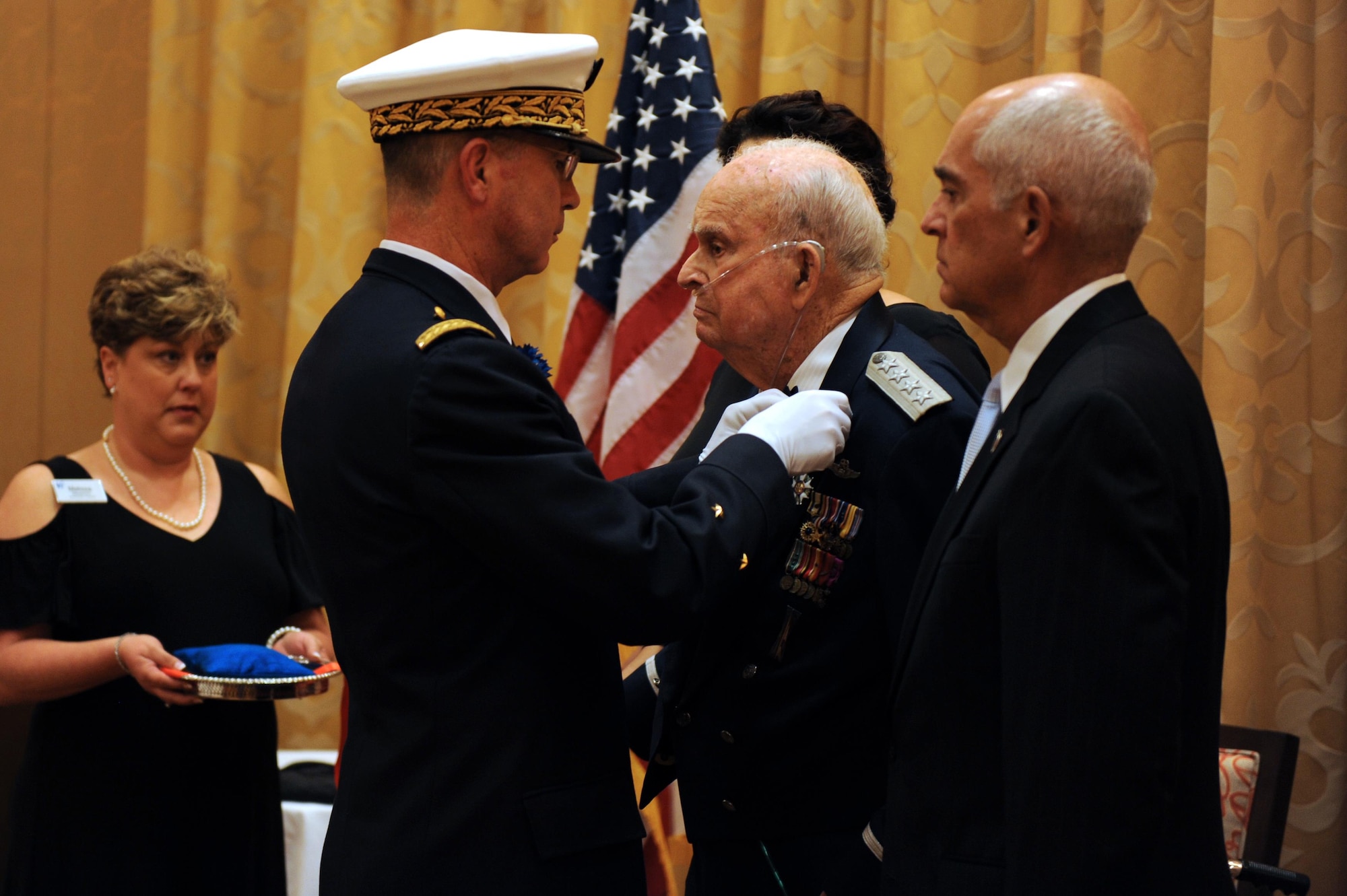 Brig. Gen. Vincent Cousin, Embassy of France in the United States defense attaché, presents retired Gen. Seth McKee, with The Legion of Honor in the Rank of Chevalier Oct. 5, 2016 in Scottsdale, Ariz. McKee is the oldest living American, four Star, general. (U.S. Air Force photo by Airman 1st Class Pedro Mota)