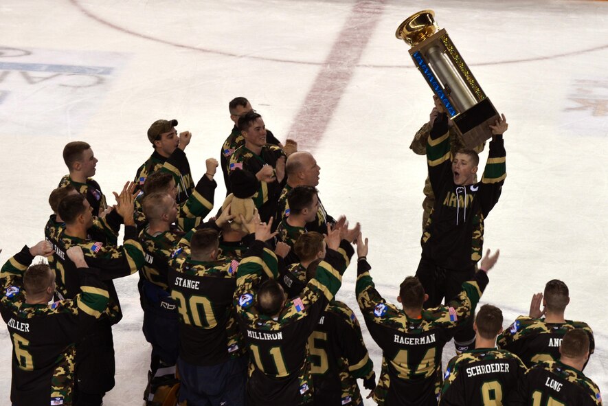 Members of the U.S. Army Alaska’s hockey team celebrate after receiving the winner’s trophy Nov. 5, 2016, at the Carlson Center in Fairbanks, Alaska. The Army won the 22nd annual Army versus Air Force Hockey game with a score of 6-0. (U.S. Air Force photo by Airman Eric M. Fisher)