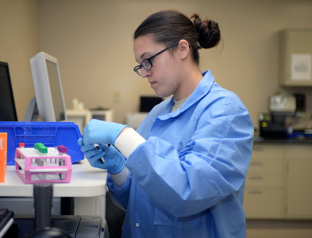 Airman 1st Class Kristen Lowder, a medical laboratory technician assigned to the 28th Medical Support Squadron, sorts various blood samples for different tests at Ellsworth Air Force Base, S.D., Nov. 7, 2016. The samples are separated into basic chemistry, which involves level checks such as glucose, enzymes and red blood cell count, while other samples require more in-depth tests, which are then sent out to varying clinics for further testing. (U.S. Air Force photo by Airman 1st Class Denise M. Jenson)