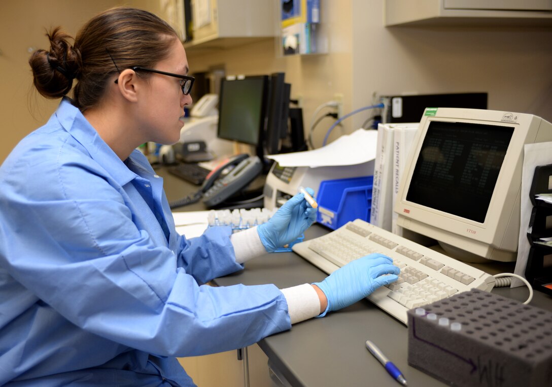 Airman 1st Class Kristen Lowder, a medical laboratory technician assigned to the 28th Medical Support Squadron, checks to ensure information between the shipment vials and database match prior to packaging at Ellsworth Air Force Base, S.D., Nov. 7, 2016. Checking information prior to shipment prevents any complications or delays in receiving a patient’s test results. (U.S. Air Force photo by Airman 1st Class Denise M. Jenson)