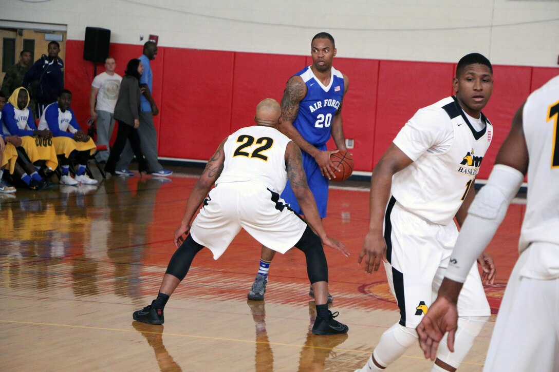 Senior Airman Jahmal Lawson (#20) eyes up the court as Air Force looks to defend their title in the 2016 Armed Forces Men's Basketball Championship. Army won 67-61 over Air Force. Lawson led the with 19-points and 9 rebounds.  The 2016 Armed Forces Men's Basketball Championship was held 1-7 November at MCB Quantico, Va. 