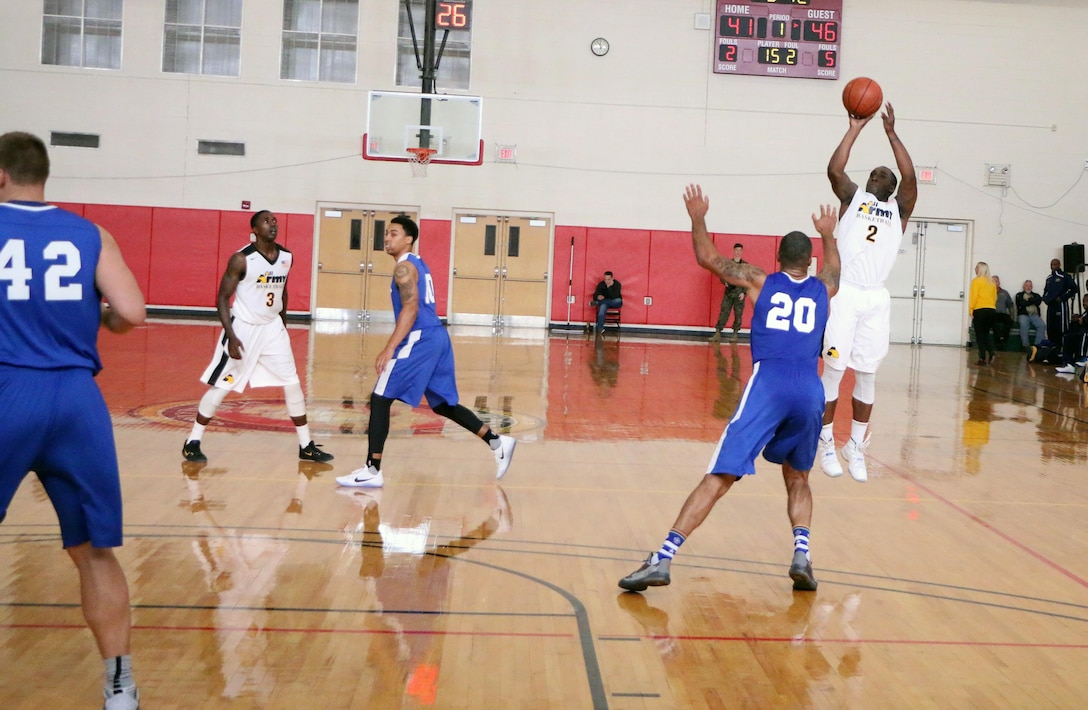 Army Spc. Rodney Clinkscales (#2) hits the three-pointer in Army's win over Air Force 67-61 to capture the gold. Clinkscales led Army with 26 points.