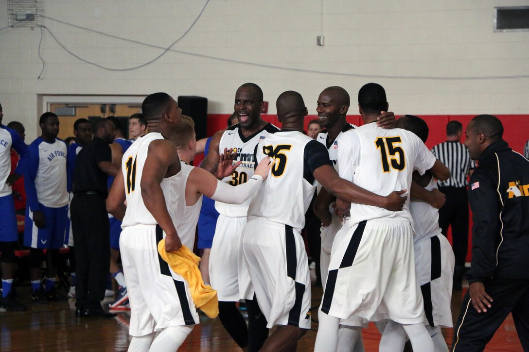 U.S. All-Army Men's Basketball Team celebrates as time expires winning the gold medal, defeating Air Force 67-61.  The 2016 Armed Forces Men's Basketball Championship held at MCB Quantico, Va. from 1-7 November. 