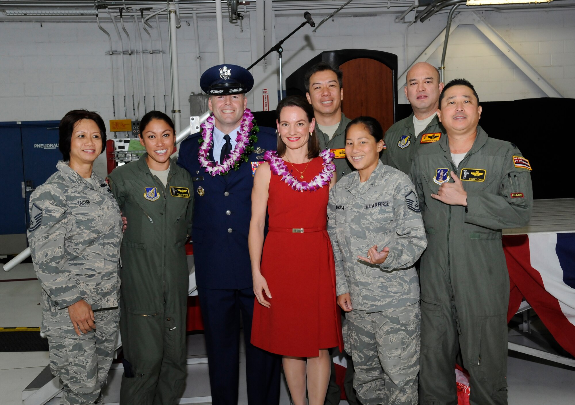 Oregon Air National Guard Col. Duke A. Pirak, and his wife Juli, center, pause for a photograph with members of the Hawaii Air National Guard, who attended the 142nd Fighter Wing Change of Command ceremony, Nov. 6, at the Portland Air National Guard Base, Ore. Pirak had been the Vice Wing commander with the 154th Wing, Hawaii Air National Guard prior to his return to Oregon. (U.S. Air National Guard photo by Tech. Sgt. John Hughel, 142nd Fighter Wing Public Affairs)