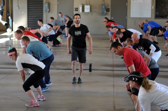 Tony Horton, celebrity fitness trainer and creator of the P90X home workout program, conducts an exercise session for 60 Airmen and dependents Nov. 3, 2016, at Roland R. Wright Air National Guard Base. Horton has conducted 51 morale visits at military installations around the globe, spreading his message of resiliency and healthy lifestyle management. (U.S. Air National Guard photo by Tech. Sgt. Amber Monio/Released)