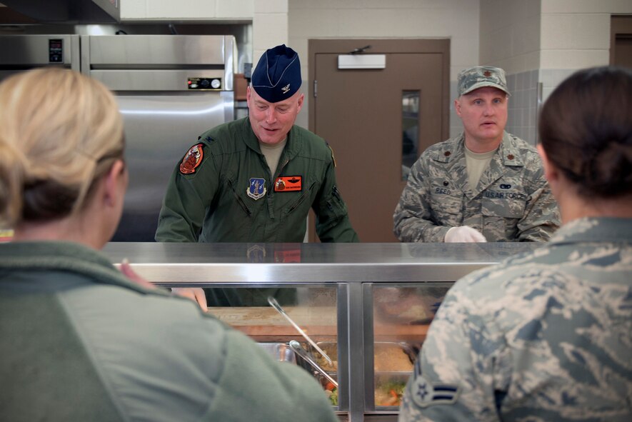 U.S. Air Force Col. Daniel McDonough, left, the commander of the 182nd Operations Group, and Maj. Robert Reed, the commander of the 182nd Logistics Readiness Squadron, serve Airmen lunch at the 182nd Airlift Wing, Illinois Air National Guard, in Peoria, Ill., Nov. 6, 2016. Leadership served lunch as a sign of thanks to the Force Support Squadron Services Flight for the work put into the special holiday meal. (U.S. Air National Guard photo by Tech. Sgt. Lealan Buehrer)