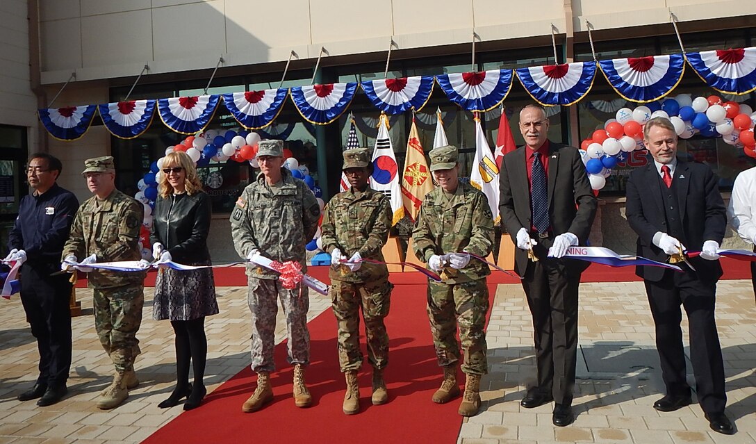 Dignitaries from U.S. Army Garrison Humphreys and Army and Air Force Exchange Service gather to cut the ribbon on a mini mall Nov. 8 at Camp Humphreys 